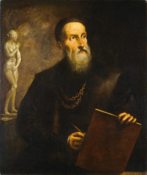 This painting shows a man from the waist up, holding a tablet-like object in his left hand, with a stylus or pencil in his right hand. He has pale skin, a long white beard and mustache, and his head is covered by a black cap. He wears a dark garment and a gold chain around his neck. In the background on the left, there is a white statue of a nude female figure standing on a rectangular pedestal. The rest of the background is dark.
