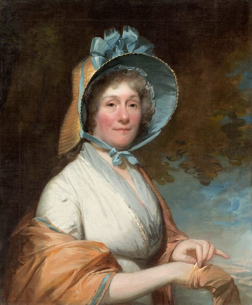 This painting features a woman from the waist up, her body angled slightly to the right, looking out at us. She has pale skin with rosy cheeks, blue eyes, arched gray eyebrows, and pink lips that are slightly upturned. Her curly gray hair is partially visible under a large straw-colored bonnet with a blue interior and a large blue bow. She wears a light blue garment with a darker blue neckline and a light brown shawl draped over her arms. Her left hand is taking off or putting on a light brown glove on her right hand. The background is mostly dark brown and olive-green tones, except for a blue patch near the bottom right corner that looks like a cloudy sky.