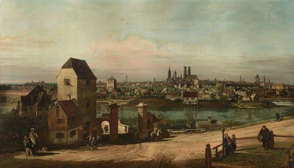 Afternoon sunlight pours over a town crowded along the banks of a serene, glass-green river that runs through the middle of this horizontal painting. Several buildings cluster to our left on the riverbank close to us. A gateway there opens onto a bridge or walkway that extends back and behind the buildings. Tiny in scale, people stand, sit, or ride singly or in small groups on the dirt road that spans the lower edge of the composition. One man sits on a bench in a fenced-in, grassy enclosure at the lower right, and another man there wears monk’s robes and holds a basket. The land must dip down steeply between the dirt road and riverbank, for a few rooftops nestled in there have chimneys at road level. Houses, churches, and grand structures line the far riverbank and fill in the town beyond. Many of the buildings are white or tan with dark red roofs, though others are brown or gray. Trees and an open green space are tucked among the structures. A pale blue sky with wispy, petal-pink and light tan clouds fills the top half of the composition.