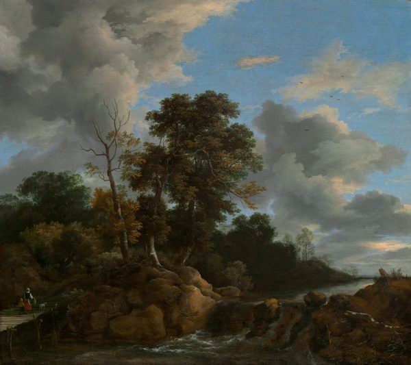 We look across a river and slightly up at a pair of tall, leafy trees framed by steely-gray clouds against a a vivid blue sky in this nearly square landscape painting. A spindly trunk with only a few leafy branches grows near the towering trees, which are at the center of the picture, and a band of dark green trees grows along the river beyond them. The river runs toward us from the distance to our right into the lower left corner of the canvas, tumbling down a low waterfall near the bottom center of the painting. The river is lined with caramel-brown boulders. A woman and small child walk away from us on a footbridge spanning the river, to our left. The woman wears a white cap and apron, a dark bodice over a white shirt, and a red skirt. She carries the handle of a large basket hooked over her right forearm and the child, wearing a tan hat and jacket and brown pants, walks on her opposite side. A white dog near the woman seems to have paused to look into the forest. The horizon of the river comes about a quarter of the way up the composition so the trees, sky, and clouds fill most of the painting. The artist signed the painting as if he had written his name on a rock to the left of center: “J v Ruisdael.”