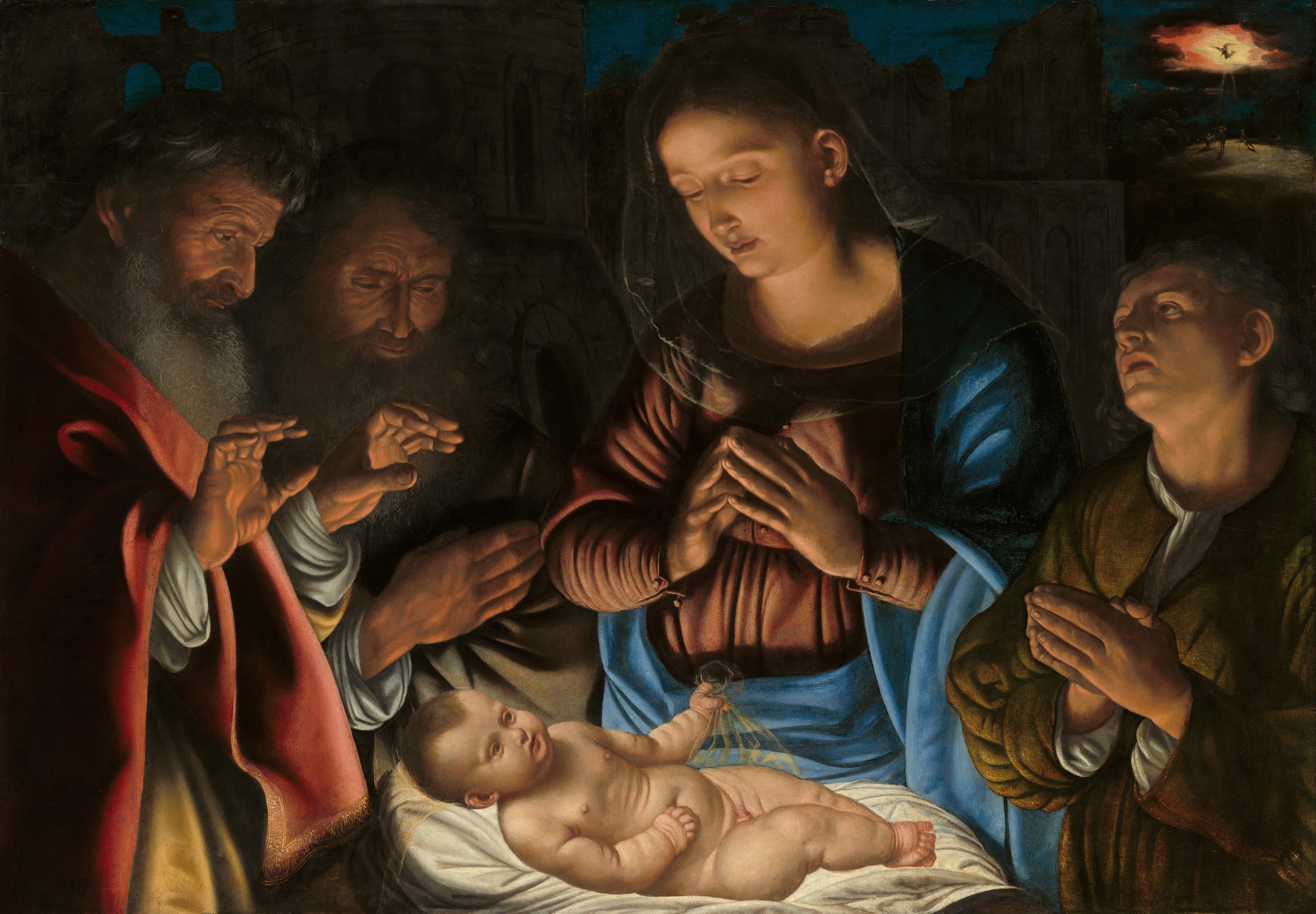 Shown from the waist up, four people surround a nude infant boy in this nighttime horizontal painting. All the people have pale skin. The pudgy baby has short brown hair and lies on a white cloth, holding the end of a translucent yellow cloth with one chubby hand. The largest person is Mary, who stands just right of center. Her hair is covered by a sheer white cloth, and she wears a lapis-blue robe over a muted rose-pink, long-sleeved dress. She holds her fingertips together over the child as she looks down at him. Two bearded men with gray hair stand to our left of Mary. The leftmost man faces our right in profile. He holds both hands up, palms out and fingers loosely curled toward the child. He wears a soft red cloak over a pale yellow garment. He and the man next to him look down at the baby. That second man holds one hand to his chest over a pale gray cloak, and the rest of his body is lost in shadow. The final person is a clean-shaven man to the right. He tips his head up and holds his hands together in prayer. He wears an olive-green jacket over a white shirt. This person tilts his head back with lips parted and eyes lifted so he looks up and to our left. The background is dark and includes what appears to be a stone building with arched windows. In the deep distance in the upper right corner of the painting, three small people are illuminated by a glow of golden and coral-red light breaking through a bank of dark clouds. A winged angel hovers in the light.