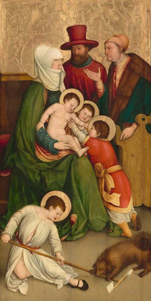 This painting shows a group of seven people gathered together, three adults and four children. On the left, woman in a blue dress, green cloak, and white headscarf is holding a nude child on her lap. She is seated on what appears to be a brown bench.  Two other children stand by her knees, playing with the child on her lap. Two men stand next to the woman on the right, one a younger bearded man in a red robe and tall red hat, and the other an older man wearing a fur-lined jacket over a peach-toned shirt and a yellow cap over his hair. In front of this group, near the bottom left corner, a fourth child in a white robe sits or crouches on the ground, holding a long T-shaped staff with white squares of cloth at the top. A small brown dog on the right is biting the staff. All seven people have pale skin, and the woman and children all have golden halos around their heads. At the top of the painting, the background is gilded in textured gold, while the floor at the bottom is gray.