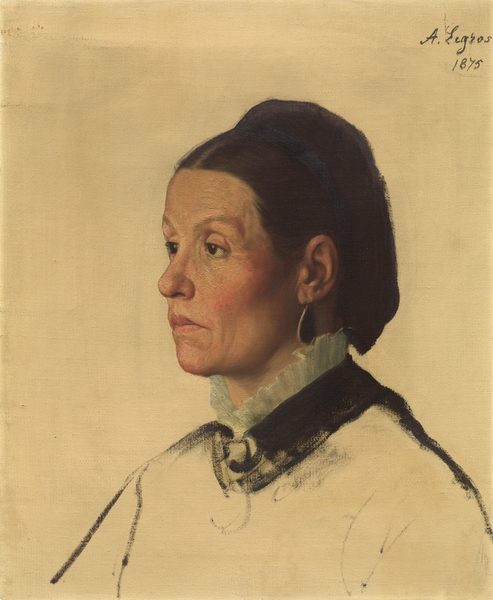 The image portrays a woman in a profile view, with her head turned towards the left. She has medium-length dark hair styled back, wearing a high-collared garment with ruffled edges. She has a sharp nose, defined cheekbones, and a firm chin. The background is a plain, light-colored canvas, and the artist's signature "A. Legros" and the year "1875" are seen in the upper right corner.