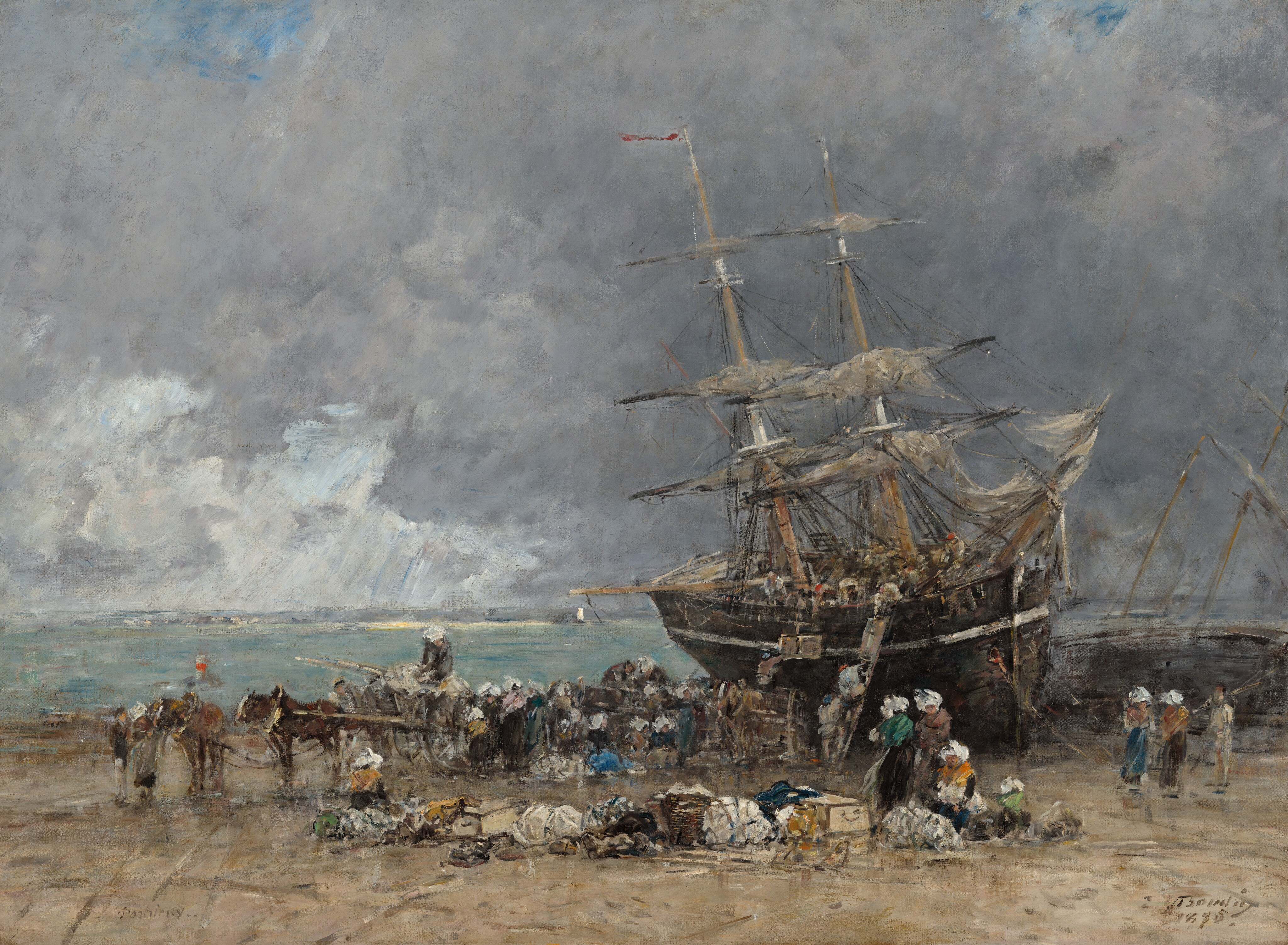 A two-masted ship with sails furled has been pulled onto a beach as dozens of people bustle on and around it in this horizontal landscape painting. The scene is loosely painted and many details are indistinct throughout. The ship dominates the right half of the composition, listing slightly to the left as the bow lodges in the sand. People working on the deck pass crates and goods down to others standing on a ladder or horse-drawn carriage pulled up alongside the hull. The women wear long brown, gray, or dark blue skirts, shawls in shades of golden yellow, marigold orange, dusky pink, or muted green, and white headdresses. The men’s clothing is earth brown and gray, and a few wear brick-red caps.  Three women and perhaps a child sit or stand to or right next to a line of goods in bundles, baskets, and crates that separate us from the line of activity closer to the shore. The horizon comes about a third of the way up the composition, and the ship’s masts thrust into a sky nearly filled with slate-gray clouds. A couple patches of vivid blue line the top of the painting, and white streaks in the distance to the left suggest sunlight pouring through another break in the clouds. The artist inscribed the site in the lower left corner, “Portrieux” and signed and dated the painting in the lower right corner, “E Boudin 1875.”