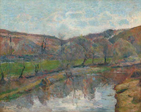 A waterway flanked by low banks curves away from us in front of a band of rolling hills in this loosely painted horizontal landscape. The water is created with wide strokes of white, ice blue, or the muted jewel tones of the hills. The riverbank in the lower right corner is also painted with wide strokes but in peanut brown, soft green, and petal pink. Tree trunks along the far bank have ghostly canopies that blend into the hills, which are painted with vertical strokes of celestial blue, amber brown, pale green, and rose pink. In the top third of the composition, a few white clouds trundle across the vivid blue sky. The artist signed and dated the painting in the lower left corner, “P. Gauguin 88.”