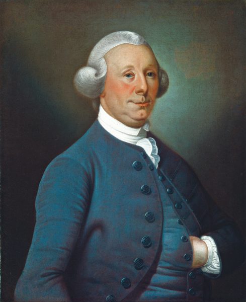 The image shows a portrait of a man's upper body. He is slightly angled to the right with his gaze directed to the left. The man has a composed expression with defined facial features, including a prominent nose and slightly uplifted lips. His hair is white and styled in a formal manner with curls on the sides. He is wearing a blue coat with large buttons, a white high-collared shirt, and a white cravat. One of his hands is tucked into the coat. The background is a muted, greenish hue.