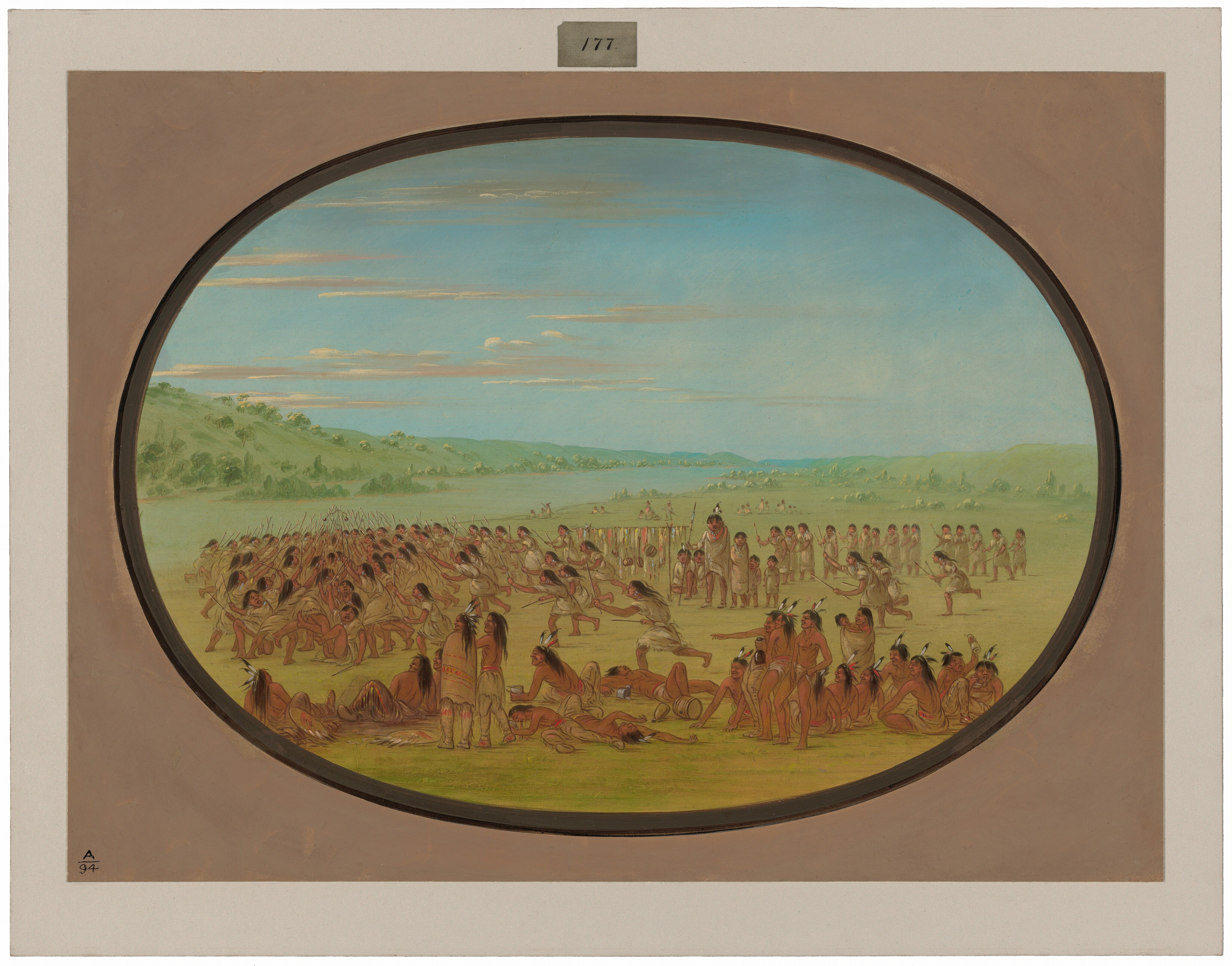 This is a painting of a large gathering of individuals in an open landscape. The scene is set in an expansive grassy area bordered by hills under a blue sky with scattered clouds. The painting features numerous figures engaged in various activities. Some are seated, others are standing or involved in a dynamic assembly. The composition suggests motion and engagement, focusing on a central activity. This is in the style of George Catlin, known for his depictions of Native American life. The overall color palette is warm, with earthy tones dominating the foreground and cooler greens and blues framing the background.