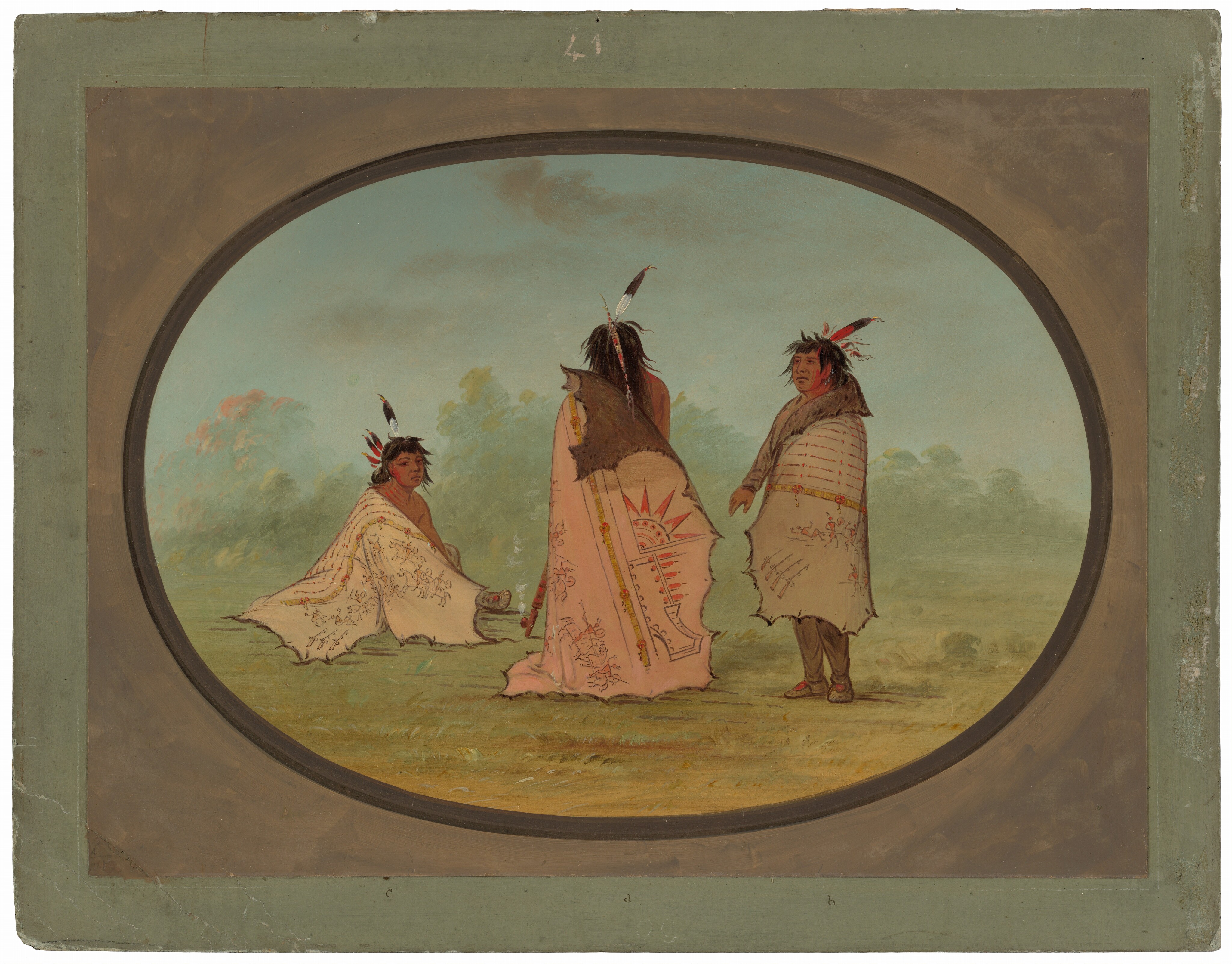 The image shows three individuals in traditional attire. One person is sitting on the ground, facing forward with their knees drawn up, while the other two stand side by side, facing each other. The seated person has medium-length dark hair with decorative feathers, while the standing individuals have similar hair adorned with feathers and one with an animal hide draped over their shoulder. They all wear finely decorated cloaks over their shoulders, featuring intricate designs in soft earth tones, and one has a sun design with vibrant colors. The setting appears to be a grassy field with trees in the background under a blue sky with light clouds.