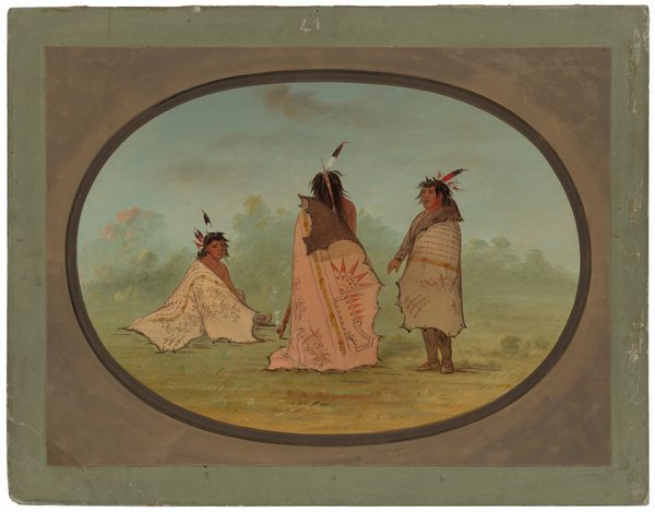 The image shows three individuals in traditional attire. One person is sitting on the ground, facing forward with their knees drawn up, while the other two stand side by side, facing each other. The seated person has medium-length dark hair with decorative feathers, while the standing individuals have similar hair adorned with feathers and one with an animal hide draped over their shoulder. They all wear finely decorated cloaks over their shoulders, featuring intricate designs in soft earth tones, and one has a sun design with vibrant colors. The setting appears to be a grassy field with trees in the background under a blue sky with light clouds.