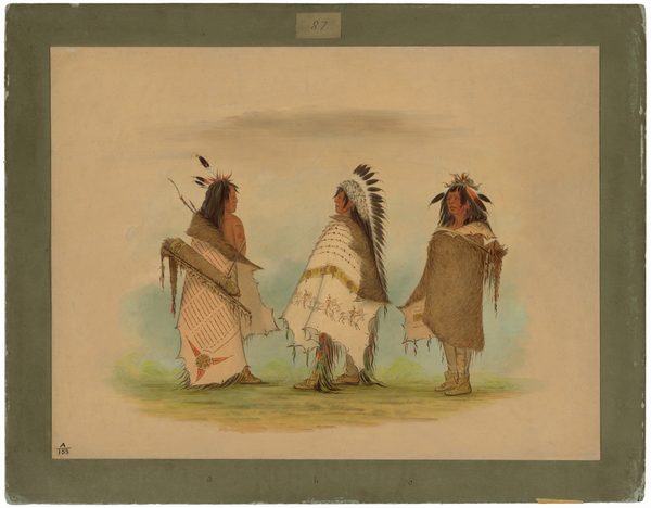 The image shows three individuals standing side by side outdoors. The person on the left wears a feather headdress and a fur wrap with colorful patterns, holding a bow and arrows. The middle person wears a feather headdress, a woolen cloak, patterned leggings, and moccasins. The person on the right wears feathers in their hair, a fur garment, and moccasins. The background is a simple, open plain with grass and a neutral sky.