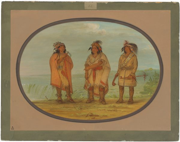 The image shows three individuals standing side by side, facing forward. The person on the left has long dark hair with feathers and beads, wearing an orange cloak. The middle figure wears a feathered headdress, a white fringed garment with red accents. The person on the right also has long hair with feather adornments, wearing a light-colored garment with patterns and a sash. They hold a curved pipe and two arrows. The background displays lush greenery, a possible waterfall or river, under a cloudy blue sky. The scene is framed in an oval border against a grey-beige outer mat.