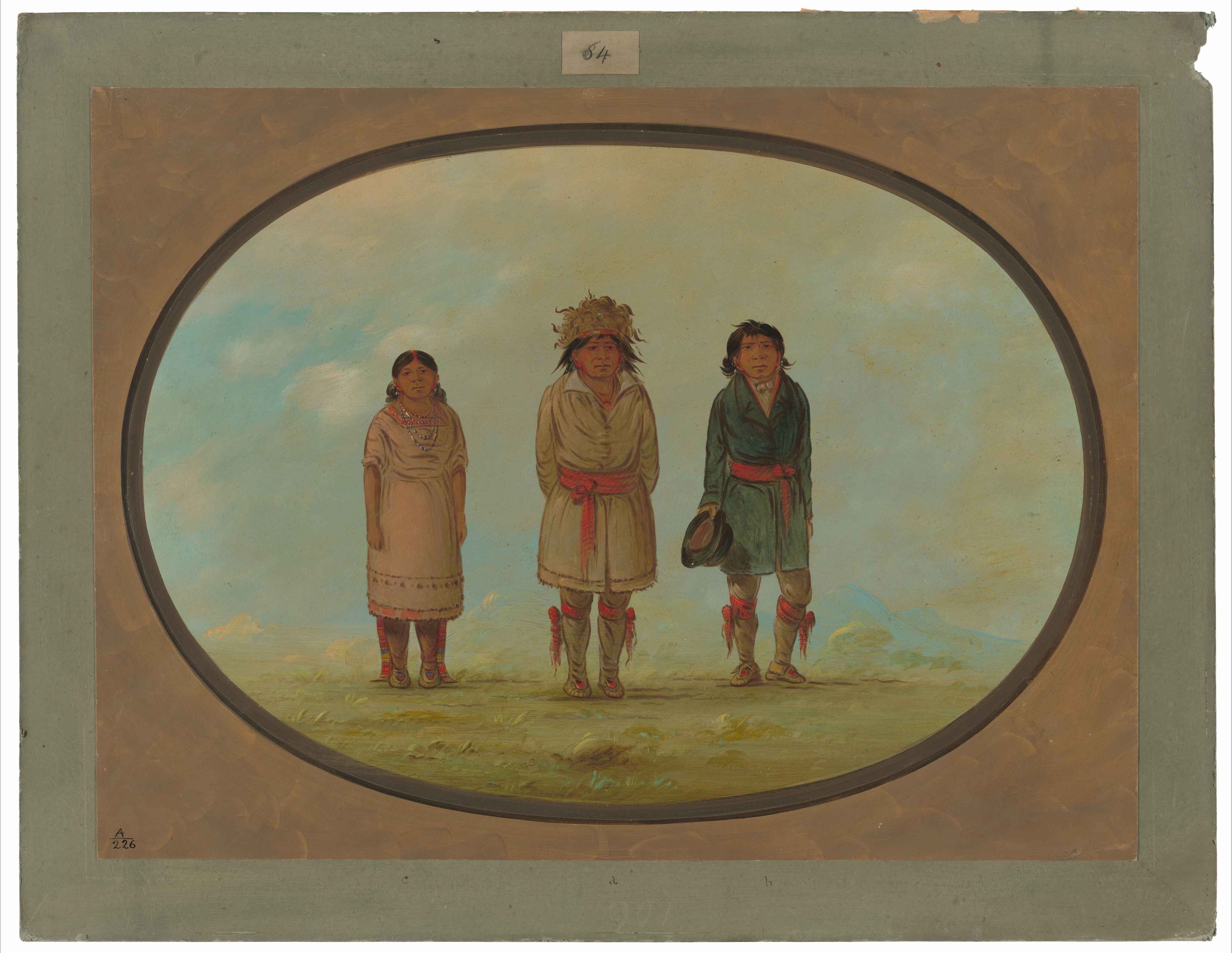 The image depicts three individuals standing side by side outdoors. The person on the left has long dark hair tied back, wearing a pink dress and moccasins. The individual in the center has dark hair with a headdress, wearing a light brown garment with red sashes. The person on the right has short dark hair, wearing a dark coat with a red sash, holding a hat. The background shows a blue sky with distant hills.