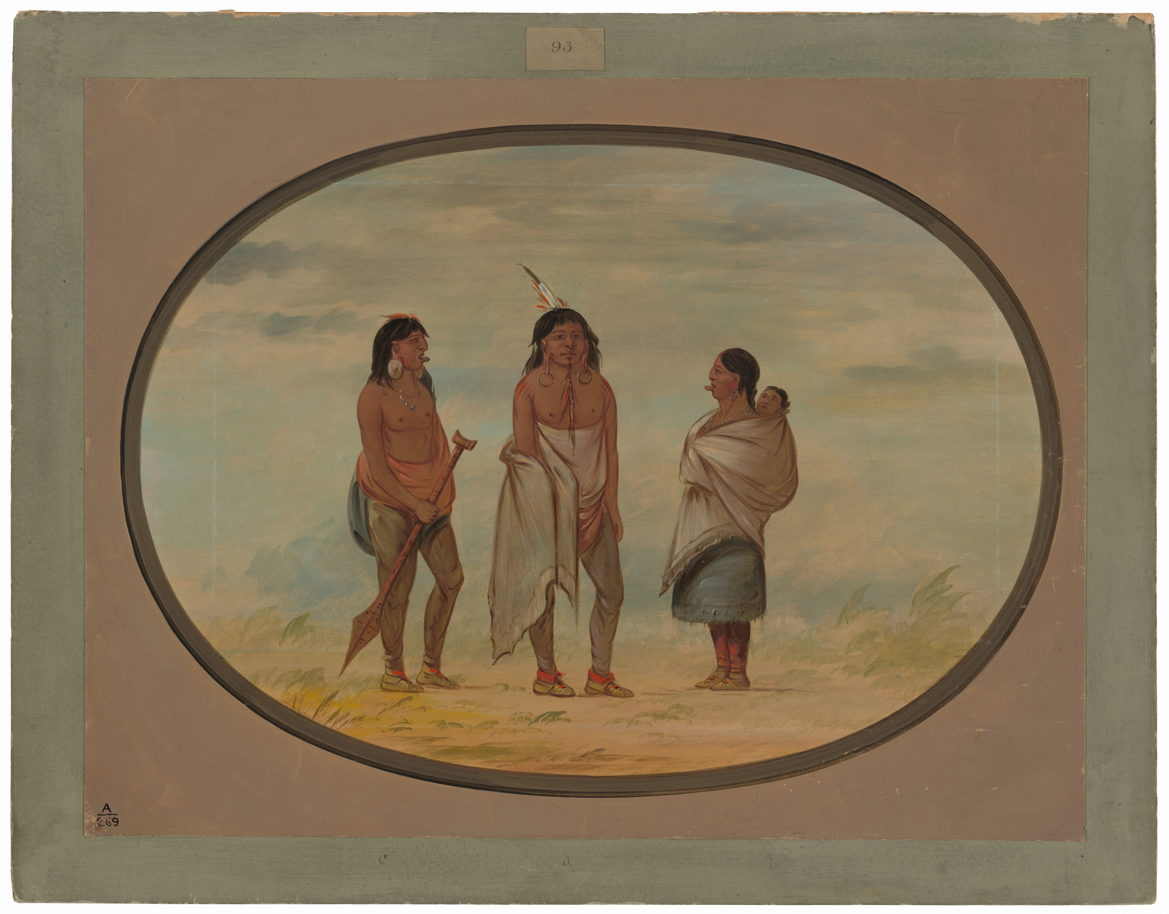 The image shows three individuals and a baby. Two men stand side by side wearing animal hide leggings, with one holding a wooden staff. They have long dark hair and calm expressions. One man wears circular earrings and a necklace, and both have feathers in their hair. The woman, standing on the right, wears a white shawl over a blue skirt and a large nose ornament. She carries a swaddled baby on her back. The background shows an open landscape with grass and a cloudy blue sky. The scene is framed within an oval on a rectangular canvas with neutral-colored borders.