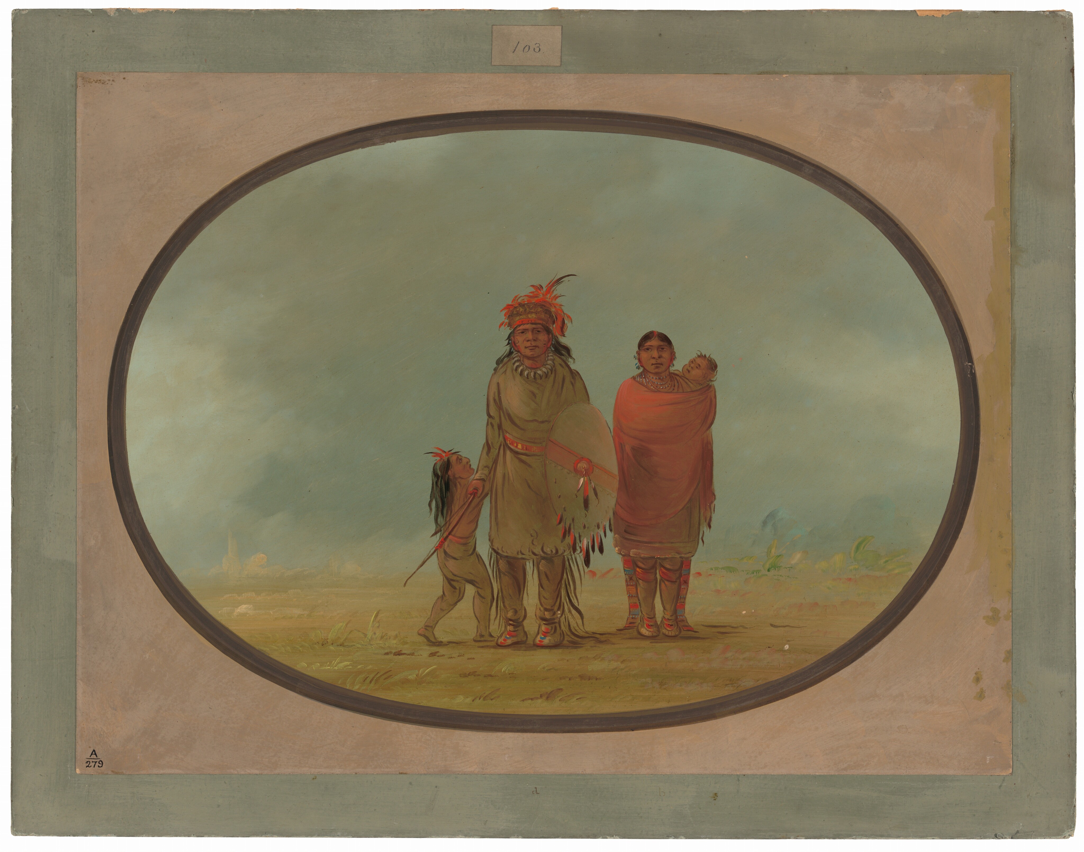 The image shows three people standing side by side. In the center is a man wearing a long garment made of animal hide with red accents and a necklace. He has a colorful feathered headdress and holds a shield and a long object. To the right is a woman wearing a red shawl holding a child on her back. The child appears to be resting. On the left is a young boy wearing a tasseled garment and a headpiece with a feather. The background is a clear sky and a plain with some greenery. The scene is framed within an oval border with a rectangle and a green outer frame.