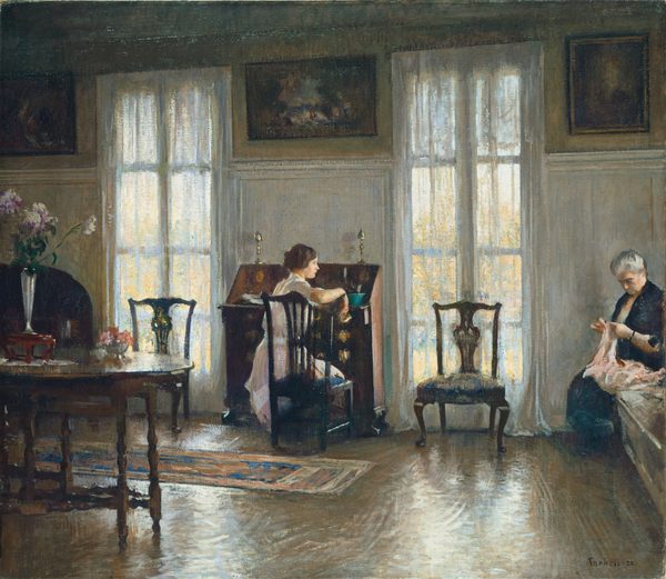 This painting shows two women in a room. At the center of the painting, a young woman is seated at a desk, her hand resting on the back of the chair, opening a small drawer. Her back is to us, but her head is turned to the right, allowing us to see her in profile. She has pale skin and brown hair in an updo behind her head, and she wears a light pink dress with white details around the waist and neck. On the right, an older woman is seated on a bench, engaged in an activity with her hands, perhaps knitting or sewing with strands of pink fabric or yarn. She has pale skin and gray hair pulled back from her face, and she wears a dark blue dress. The room around the women is elegantly furnished, with a wooden table on the left, more wooden chairs, large windows with curtains on either side of the desk, and paintings along the top edge of the yellow wall. The floor is brown and polished, reflecting white and yellow light from the large windows. The brushstrokes in the painting are soft and visible.
