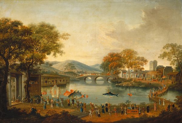 This painting shows a waterfront viewed from high above. In the background, light blue hills obscure the horizon line. In front of these hills, a stone bridge arches across the water, connecting two sides of a river. Another bridge crosses the river on the right side of the painting. At the bottom of the painting, an ornate procession with lanterns and banners in the shape of large fish takes place close by. Both adults and children are involved in the procession, and the line of people snakes back across the bridge at the right, across the stone bridge, and into the distant hills. On the opposite shore are small buildings with red-tiled roofs, and a tower stands prominently in the background. The procession ends in a large building in the bottom left corner of the image, framed by tall trees. The color palette features warm earth tones with shades of ochre and rust, contrasted by the soft greens of the trees and the blues and grays of the water.