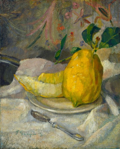 This painting shows a large yellow lemon resting upright next to a wide slice of yellow fruit on top of a white plate. A long, light-green stem emerges from the top of the lemon, and several dark green leaves sprout from it. Under the plate is a draped white tablecloth that is painted with hints of light blue and green. A silver butter knife is on the tablecloth in front of the fruit plate. In the background, colorful patterns stand out against a gray wall. The patterns are mainly floral designs in shades of orange, light pink, purple, and yellow.