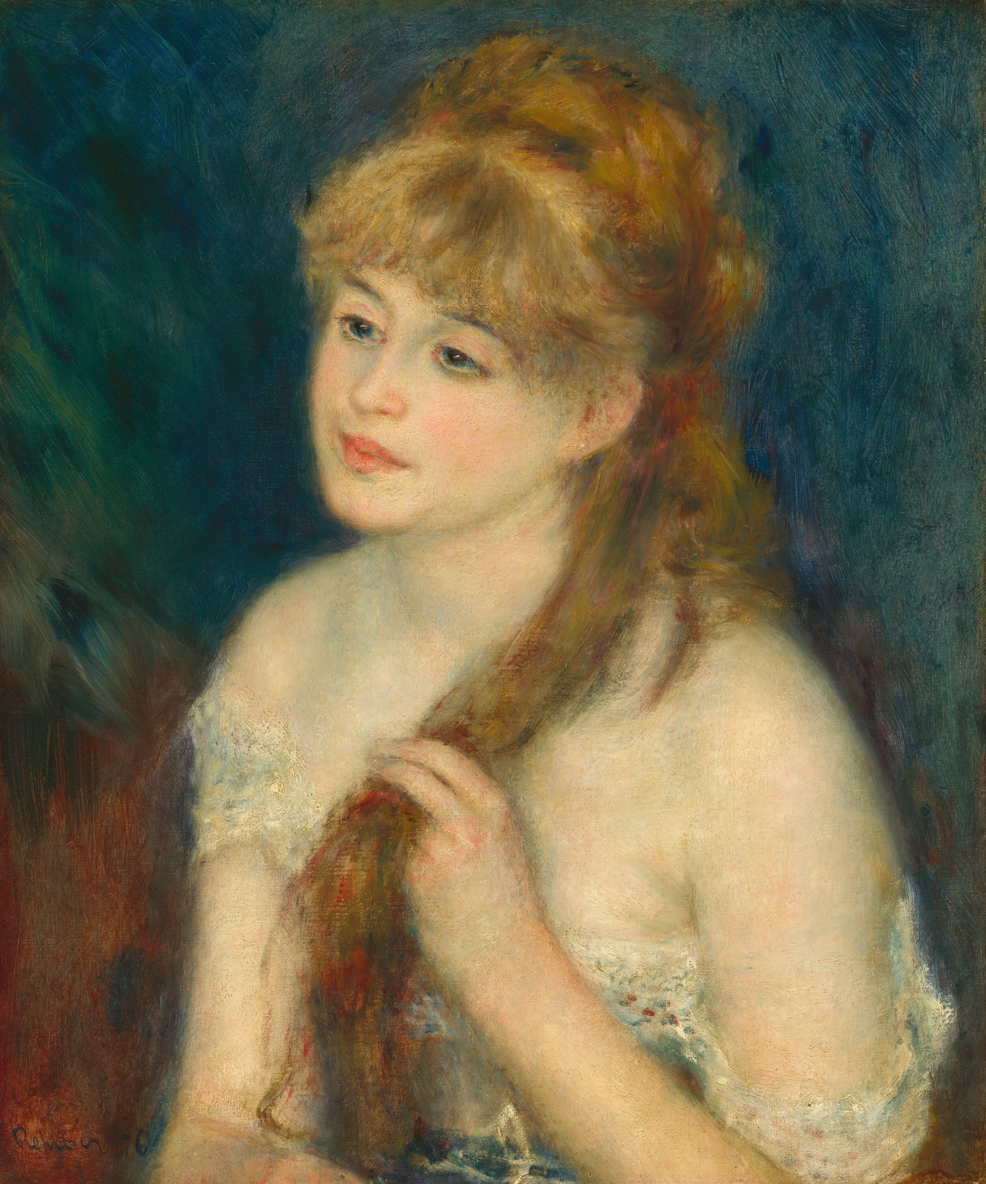 A young woman with peachy skin shaded with ice blue and pale, mint green is shown from the chest up wearing a low-cut, white garment in this vertical portrait painting. The painting is created with blended brushstrokes, giving it a soft, blurred effect. The woman’s body is angled to our left and she looks off in that direction with blue eyes, her head tipped a little toward us. She has a straight nose and full, rosy pink lips. Thick, blond bangs sweep across her forehead, and her hair is partially pulled back. She holds one long lock with her left hand, on our right, in front of her shoulder. One small gold ball earring adorns the ear we can see. Her low-cut, white garment falls off her shoulders and is belted with a blue sash at her waist. The background is made up of a field of royal and turquoise blue behind her head and shoulders, and rust brown behind her body. The artist signed and dated the work with dark paint in the lower left corner: “Renoir.76.”