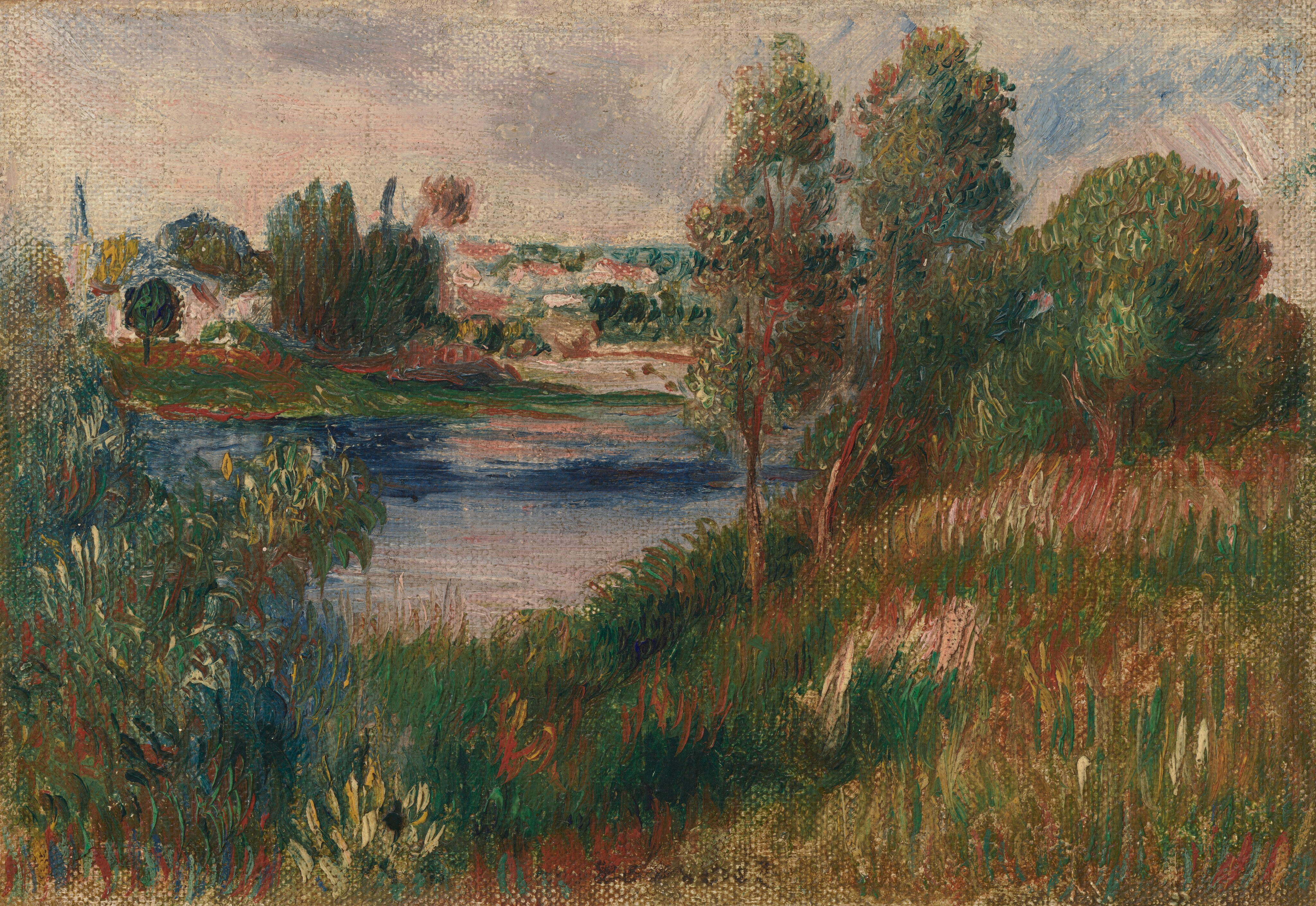 Tall grasses lead back to a body of water and then perhaps a town in this loosely painted, horizontal landscape. Brushstrokes are visible throughout, and the color palette is saturated with dark, jewel-toned blue and green, a few touches of citrine yellow, and rosy pinks. Tall, straight strokes suggest marshy grasses along the front two-thirds of the painting, and shorter flicks in slightly cooler greens to the left could be bushes. The water is streaked with pale pink across sapphire blue. Strokes beyond that suggest white-walled buildings with muted red roofs in a town tucked between trees in the distance. The horizon comes three-quarters of the way up this composition, and the sky above is painted thinly with pale purple, pink, and blue. The texture of the canvas shows through in many areas, especially around the edges and in the sky. The artist signed the lower center, “renoir.”