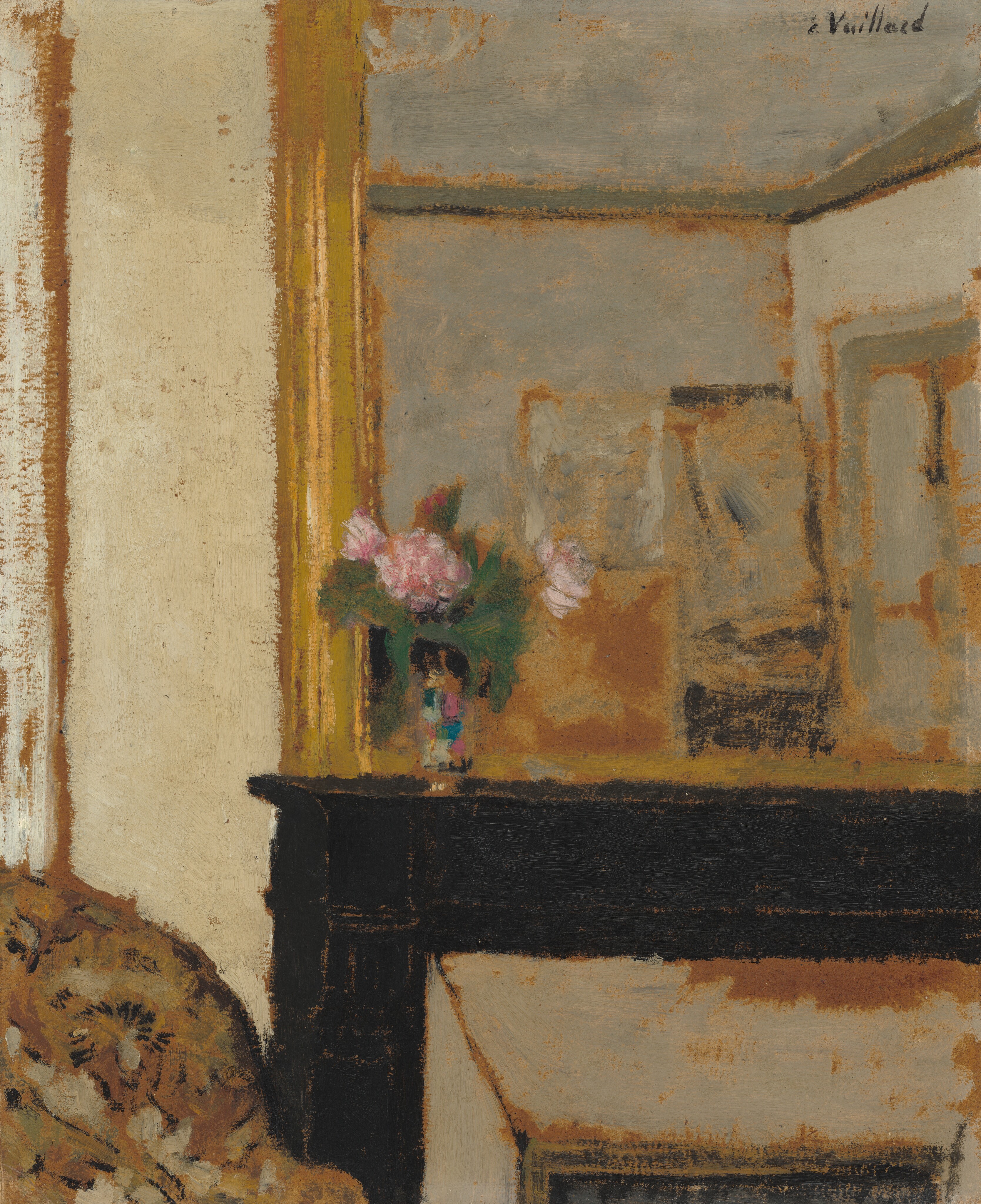 This painting shows a partial view of a dark wooden mantle. The mantle itself takes up the bottom right corner of the painting, and we see one side of it, but not the other. On its left corner, there is a vase of pink flowers, which stands at the center of the painting. Behind the vase, on top of the mantle, is a large silvery mirror in a golden frame. The mirror reflects gray walls and indistinct rectangles of black, gray, and brown.  In the bottom left corner, there is a patterned brown and white object, perhaps furniture or draped fabric. The wall on the left of the mantle and the mirror is a cream color. In some areas of the painting, the reddish-brown material beneath the paint is visible.