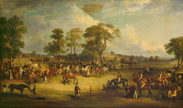 The painting depicts an equestrian scene with people and horses in a green landscape. There are several people on horseback, and others standing by horses. Some people are also sitting in horse-drawn carriages. The horses are in a variety of colors, and the people wear formal clothing like suit jackets, top hats, vests, or colorful dresses. People fill the middle of the scene and the green hills that rise to the left, while a wide path is marked off on the right, bordered by fences. There are some tall trees around the area, with people gathering below them. In the distance, a large white building with columns and blue roofs can be seen. There is also a white tent partially behind a hill on the left. The sky above is blue and filled with white and gray clouds.