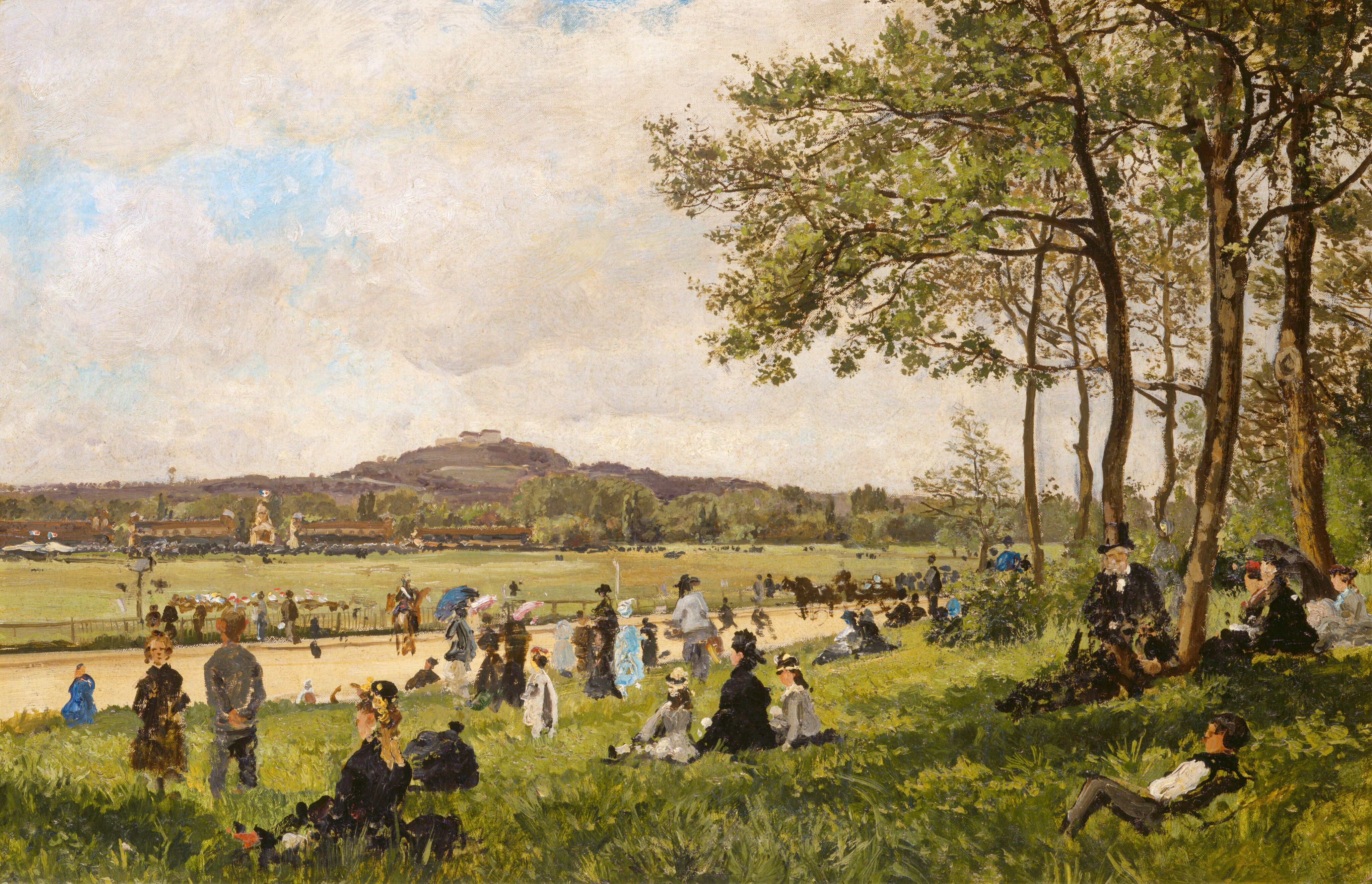 This painting shows a countryside scene by a wide dirt path with a distant horizon featuring low hills. The light blue sky above is covered in puffy white clouds. Closest to us, at the bottom of the painting, is a grassy green slope with trees in front of the wide path. People sit or stand in the grass, facing away from us and towards the path. Along the path are people on horseback. On the far side of the path is a wide, open field that leads to low brown buildings and a few white tents. Dark smudges suggest crowds of people outside of these buildings. The color scheme includes earthy greens, browns, tans, creams, blues, and whites. The painting uses short, thick brushstrokes, and dots and streaks of paint suggest details rather than showing them clearly.