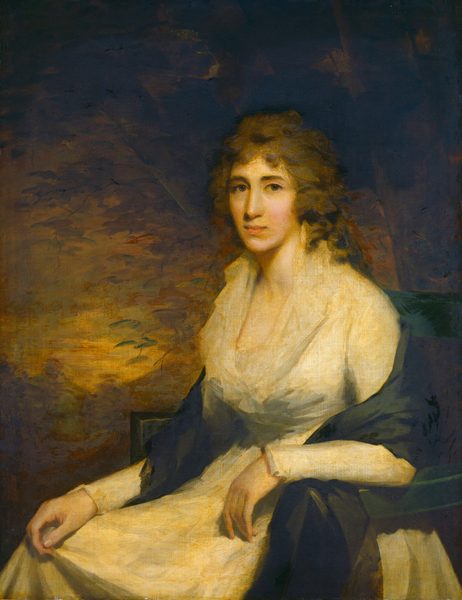 The image is a portrait painting of a woman. She is seated with her body turned slightly to the right, while her head is facing forward towards the viewer. She has a gentle expression with slightly raised eyebrows. Her light brown hair is styled in loose curls framing her face. The woman is wearing a light-colored dress with a high collar and long sleeves, and a dark shawl over her shoulders. Her hands are resting on her lap, one lightly holding the fabric of her dress. She is wearing earrings. The background is a deep, muted blend of dark hues with hints of leaves or branches.