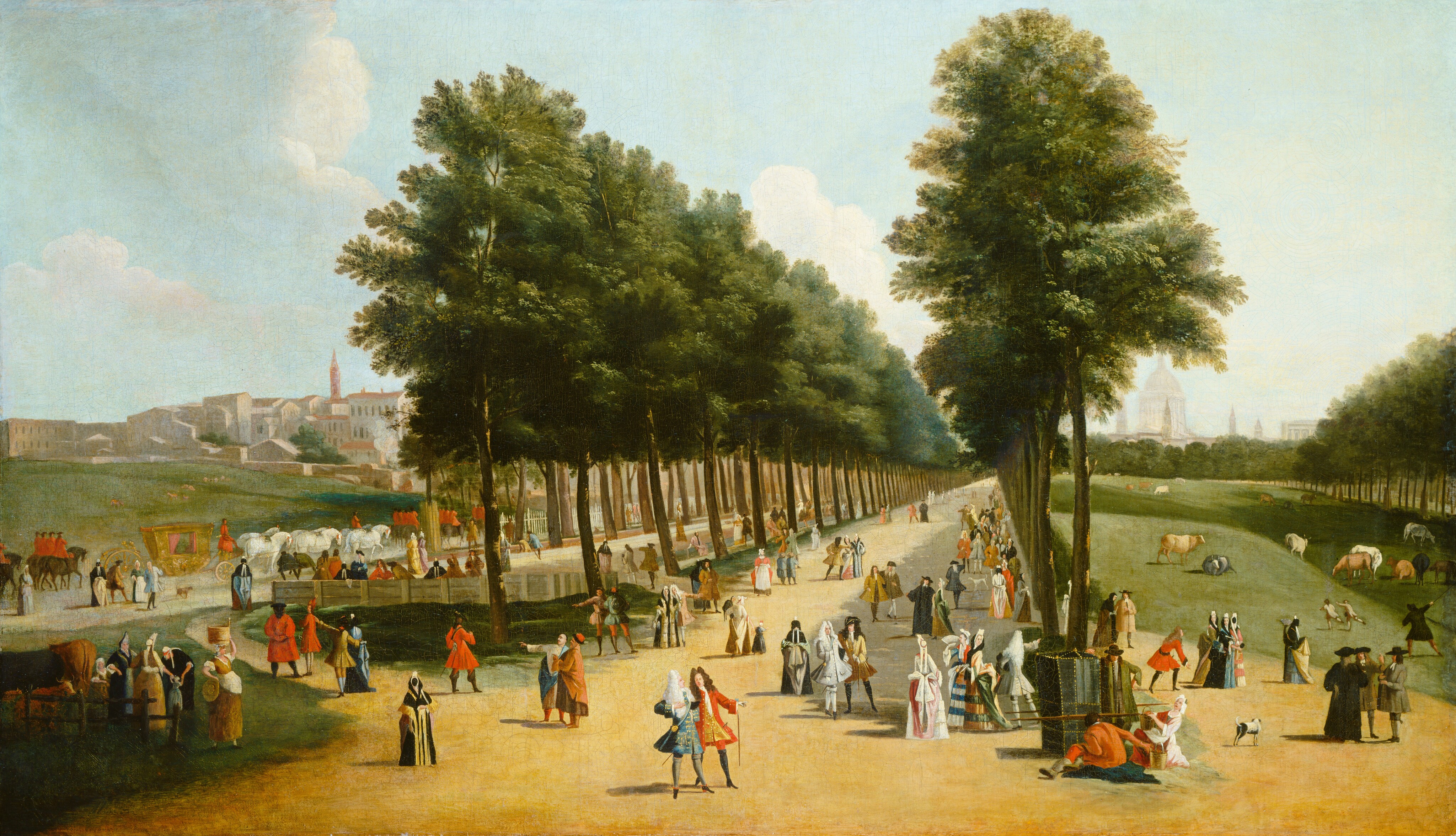 This painting shows a park scene from an elevated viewpoint. In the center of the image is a tree-lined path. The green trees are tall and grow in straight rows on either side of the tan path. Small people in red, blue, and white outfits populate the scene. Some people walk in groups or sit on benches, while others carry baskets. To the right is a green field with grazing animals. In the distance there are white and tan buildings, including a spire and dome. The sky above is blue with light clouds.