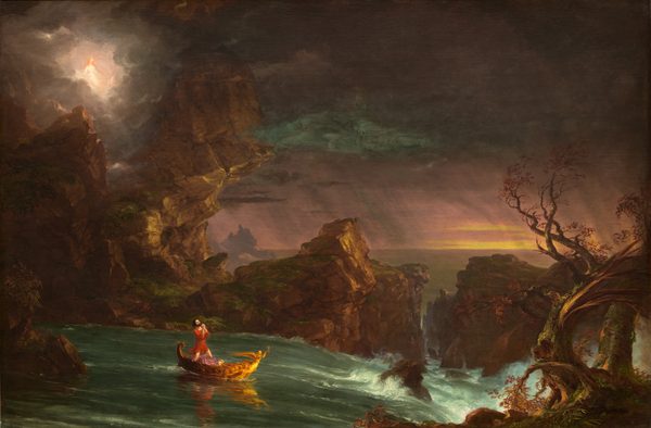 A man looks up as he kneels with his hands clasped in prayer in a small golden boat on a river that rushes toward craggy rocks in this horizontal landscape painting. The man has pale skin, dark brown hair and beard, and he wears a crimson-red tunic. A winged figurehead at the front of the gold boat holds up an hourglass. The boat sails to our right, away from calm waters to the left toward whitewater rapids along the right edge of the composition. A ridge of tall, jagged, moss-covered rock lines the water’s edge to our left and another channels the water on the opposite side of the river. Closest to us, a barren, blasted tree twists up from the lower right corner. The river passes off the right edge of the canvas, and calm waters beyond extend into the distance. The horizon line comes just under halfway up the composition. Bands of golden yellow break through the deep mauve-pink sky near the horizon line to our right. Diagonal plum-purple streaks suggest falling rain in the distance. A white glow in the upper left corner emanates around a person with long, reddish-blond hair and pale skin, who looks down at the man in the boat. That person wears a white garment and a golden star shines at the forehead. Smudges of fog blue in the sky above the man first read as clouds but upon closer inspection, the cloud-like forms contain the faces of three bearded men.