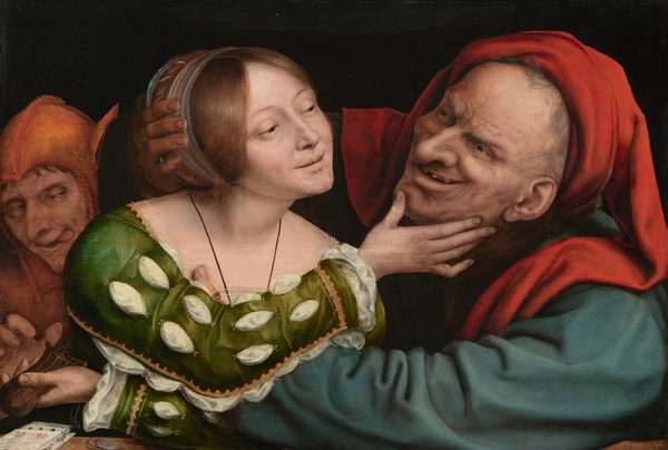 A smiling young woman and an elderly man with exaggerated features embrace and gaze into each other’s eyes while a person dressed in the orange costume of a fool lurks behind them to our left in this horizontal painting. All three have pale skin and are shown from the chest up behind a ledge or tabletop against a black background. The older man to our right wears a dark teal-blue garment and a bright crimson-red head covering that drapes over both shoulders. Wrinkles and age spots cover his face, which is accentuated by a bulbous nose and a leering smile that exposes missing teeth. His arms reach out and encircle the woman to our left. Cradling the right side of her head with his right hand, his left arm reaches across to her upper body, his thumb visible at her breast. A blue and gold band holds the woman’s auburn-brown hair back. A white shift peeks through the slashed sleeves of her emerald-green, gold-trimmed gown. She reaches toward the elderly man with her right arm, her hand holding his chin. Her left arm reaches across her body under his arm and she holds a leather pouch in that hand. A man wearing an orange cap with asses’ ears reaches for the pouch, eyes crossed and his tongue protruding from the side of his mouth. Playing cards and coins lie on the ledge to our left.