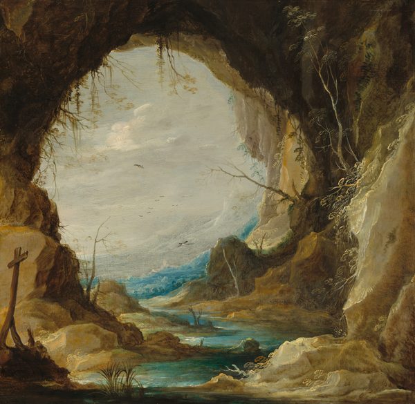 The round, cavernous entryway of a craggy grotto that opens onto vivid blue water nearly fills this square landscape painting. Close to us, steep, tan-colored and earthy brown rocks rise like cliffs to each side. A wood cross set on a low rocky outcrop lists to one side in the lower left corner of the composition.  A few tufts of grass or reedy plants are interspersed along the winding path of the turquoise-colored water inside the grotto, and more spindly plants grow up from or out of the rocky surfaces. The waterway zigzags between us and the body of water just beyond the opening. White highlights suggest white caps or surging waves. A band of opal-white mountains follow the curve of the grotto opening to angles up to the right. They nearly blend into the pearly white sky and the screen of clouds there. Black and white birds fly in the distance. One is near the water on the far side of the grotto opening, and one is higher and farther back. At least seven are tiny in the deep distance.