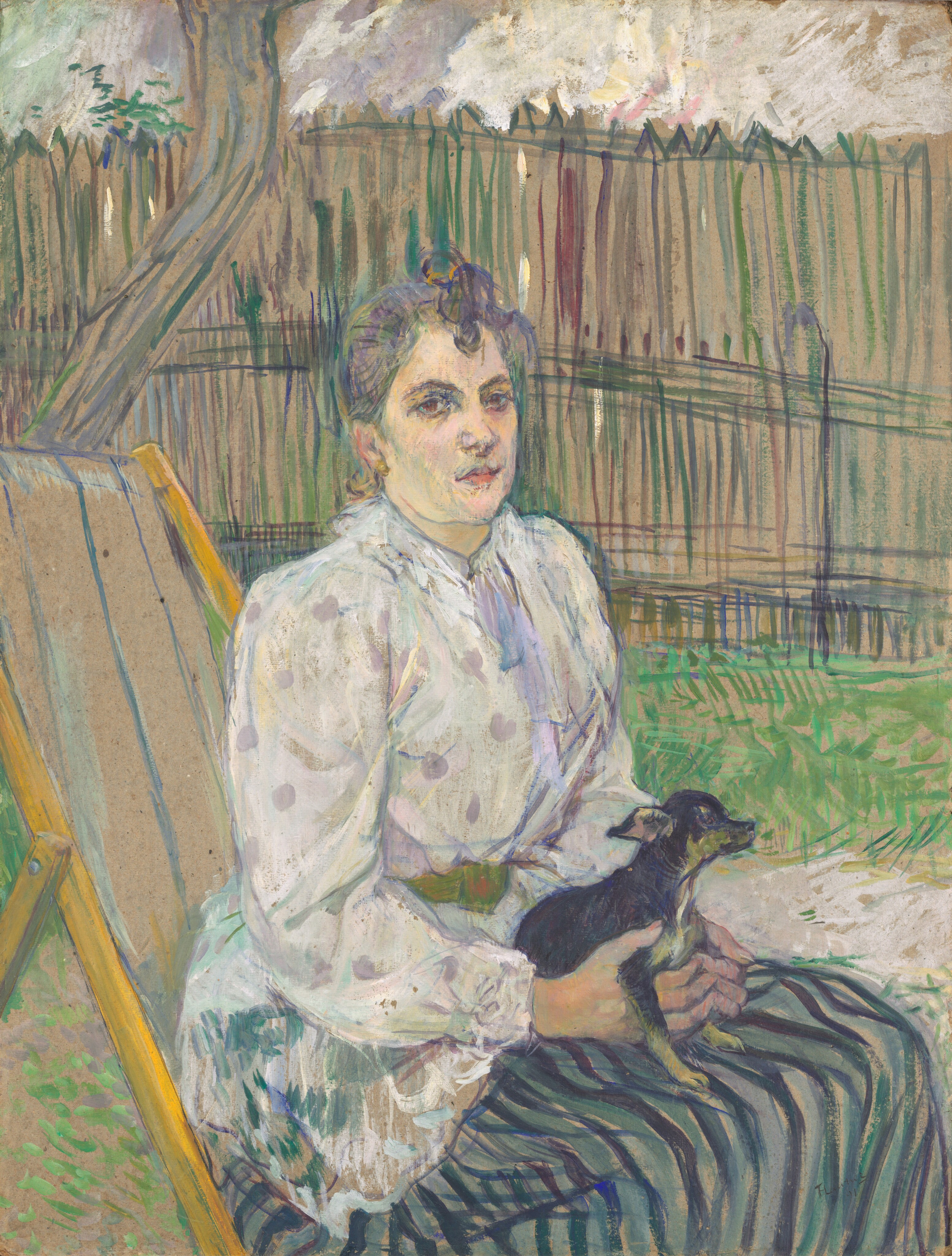 This painting shows a woman sitting upright in a yellow-and-tan reclining chair, her body turned to the right, her face turned toward us. Her skin is pale, with shades of pale yellow and light pink, and shadows in a pale green shade. She has deep-set brown eyes, arched eyebrows, and a small pink mouth set in a neutral expression. Her curling hair is light purple and put in an updo. She is wearing a white and lilac polka-dot blouse with puffy sleeves, complemented by a long skirt with stripes of black, gray, and green. In her lap, she holds a small black, tan, and light-green dog, cradling it gently with both hands. The background features a grassy area enclosed by a wooden fence painted with lines of green, teal, and dark red, with a large, slightly bent tree trunk visible to the left. The sky above has a cloudy appearance made by crisscrossing lines of white, purple, pink, and green. The brushstrokes in the painting are thick and visible, especially those in the background. In some places, like the fence, the tree trunk, and the back of the chair, the light brown surface under the paint is visible.