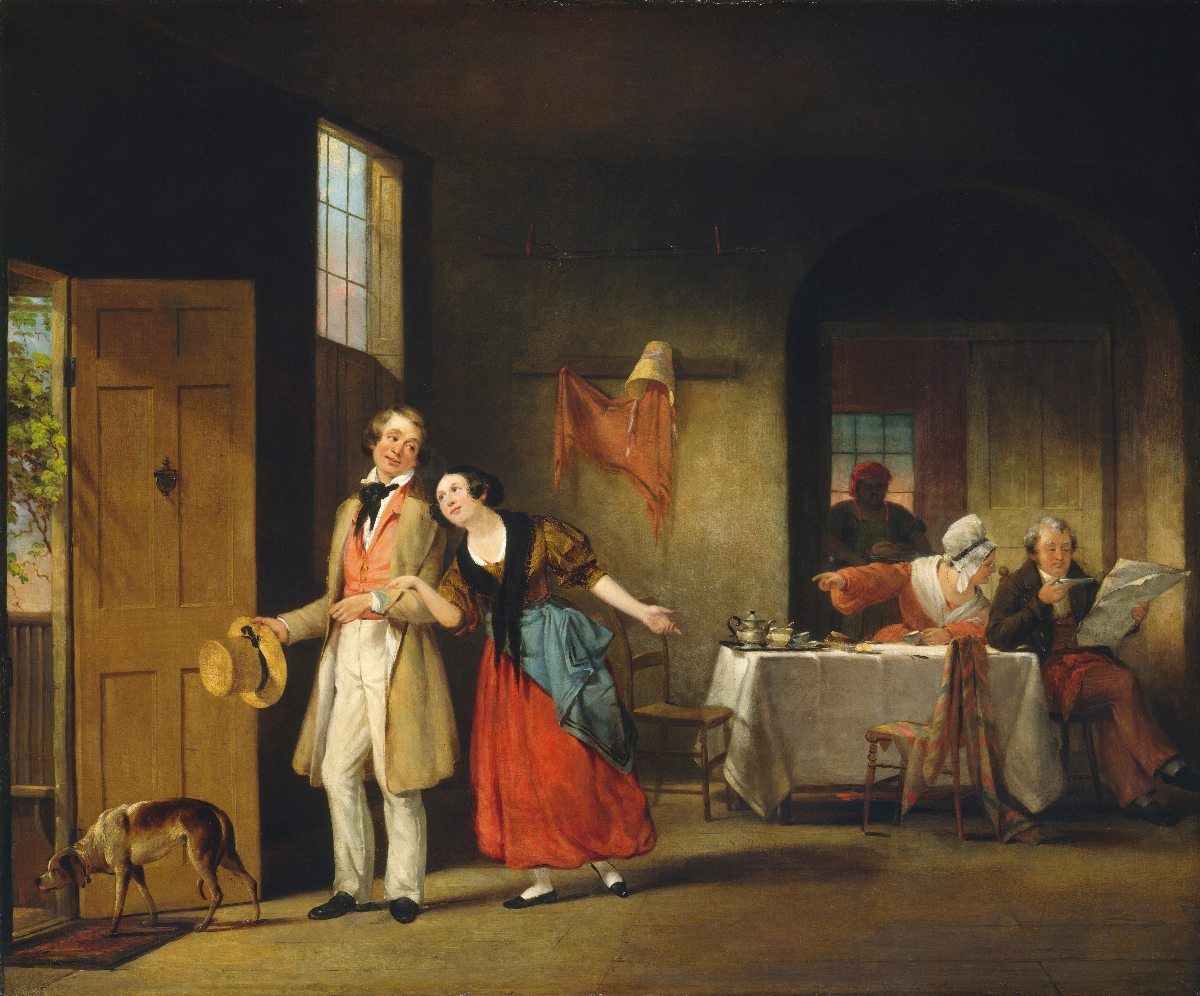 In the bottom left corner of this painting, a dog stands at an open door, through which light streams into a dark house. On the edge of the doorway, a man and a woman are standing, their arms linked. The man's body is turned towards the doorway, while the woman gestures back into the room. Both of them have light skin, and the man has blond hair while the woman has dark hair. He wears a tan jacket over a pink vest and white pants, while she wears a brown blouse and a bright red skirt with a blue cloth tied around her waist and a black scarf. To the right, a table covered in a white cloth is set with a tea service and two empty wooden chairs. A man and a woman sit on the right of the table, the man reading a newspaper and the woman looking towards him, pointing at the couple in the door. Both of these people also have light skin, and the man has gray hair while the woman wears a white bonnet. In the background behind the table, an archway leads to another room. A person with dark skin stands in the doorway, looking out at the table, holding a roast chicken on a plate. This person wears a red bonnet and a green apron. The walls and floor of the room are brown, with some areas of light and some of shadow.