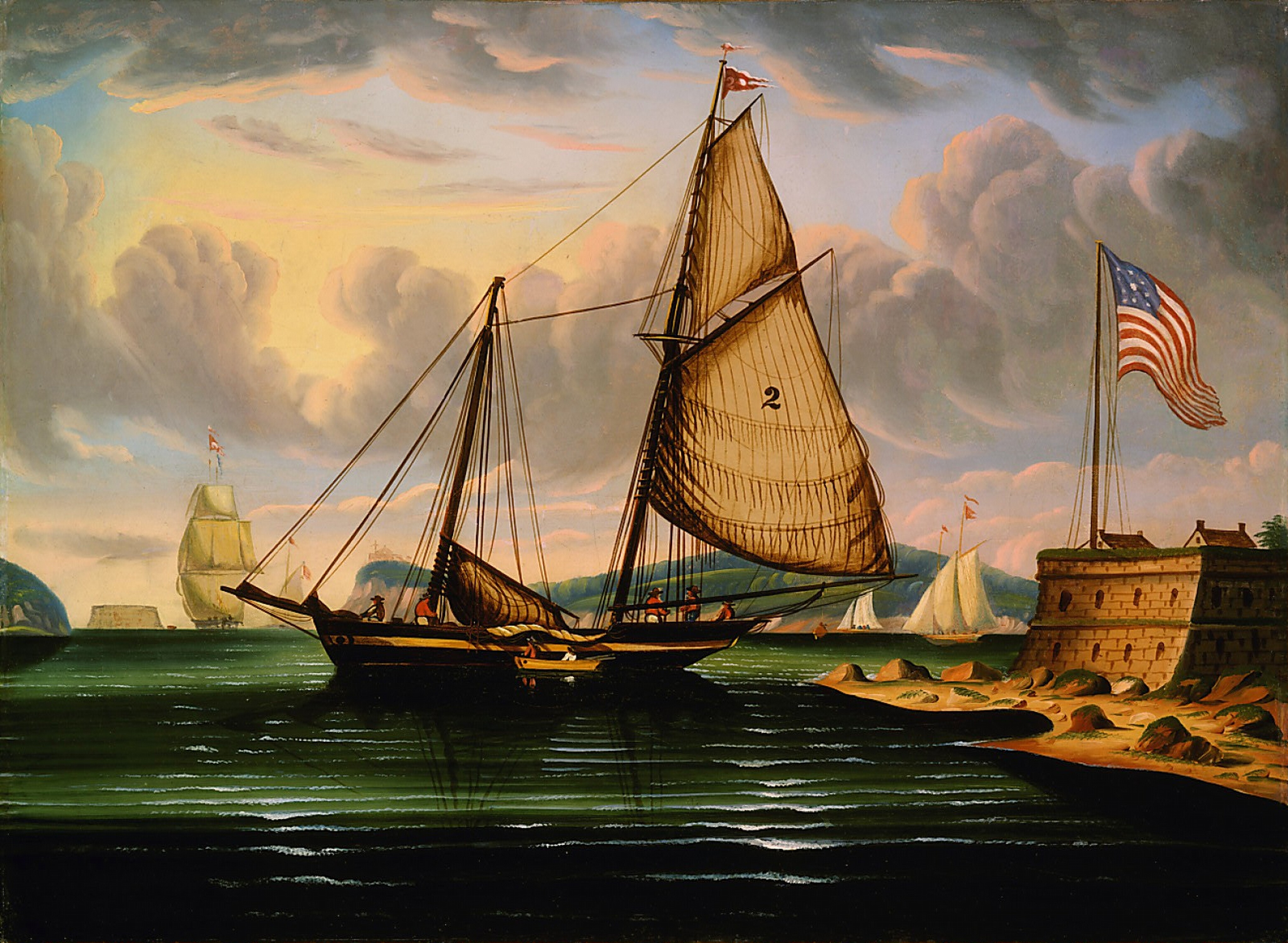 The image shows a maritime scene with multiple sailing ships at sea. The perspective is from slightly above water level, showing the sea, sky, and land meeting at the horizon. The closest ship has billowing sails, giving a sense of motion. The brushstrokes are deliberate and smooth, defining the sails and water. Light and shadow create a warm, colorful sky with pastel hues blending into blues and grays. An American flag flies from a fortification on the right-hand side. Other ships can be seen in the distance, adding depth to the scene. The flag's colors contrast with the background.