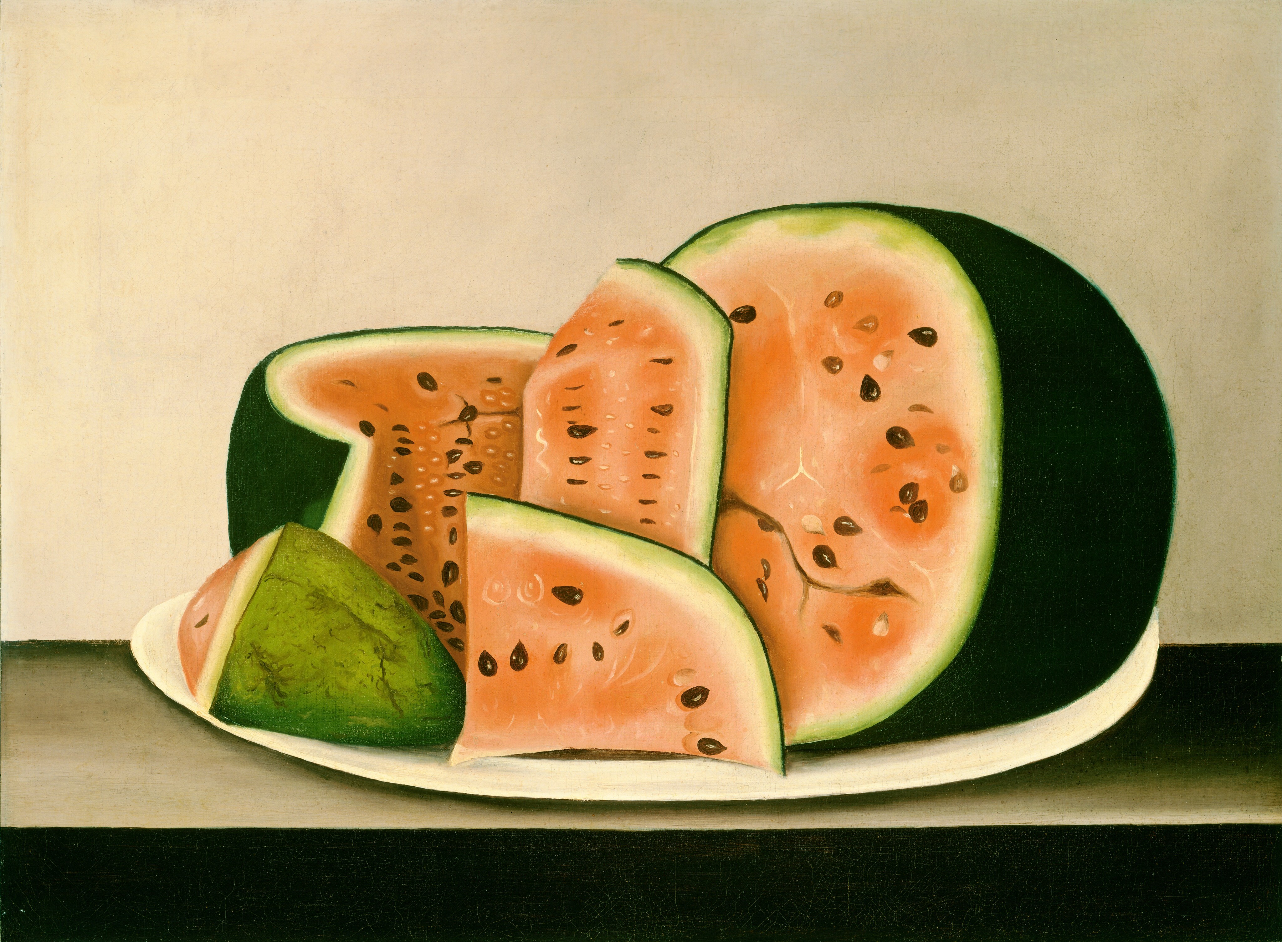 This painting shows a sliced watermelon on a white plate. The watermelon has red-pink flesh dotted with black seeds and smaller white seeds and surrounded by a dark green rind. Half of the watermelon is intact on the right, while the other half has been cut up in sections of different sizes on the left. The surface under the plate is gray with black shadows, and the background is gray.