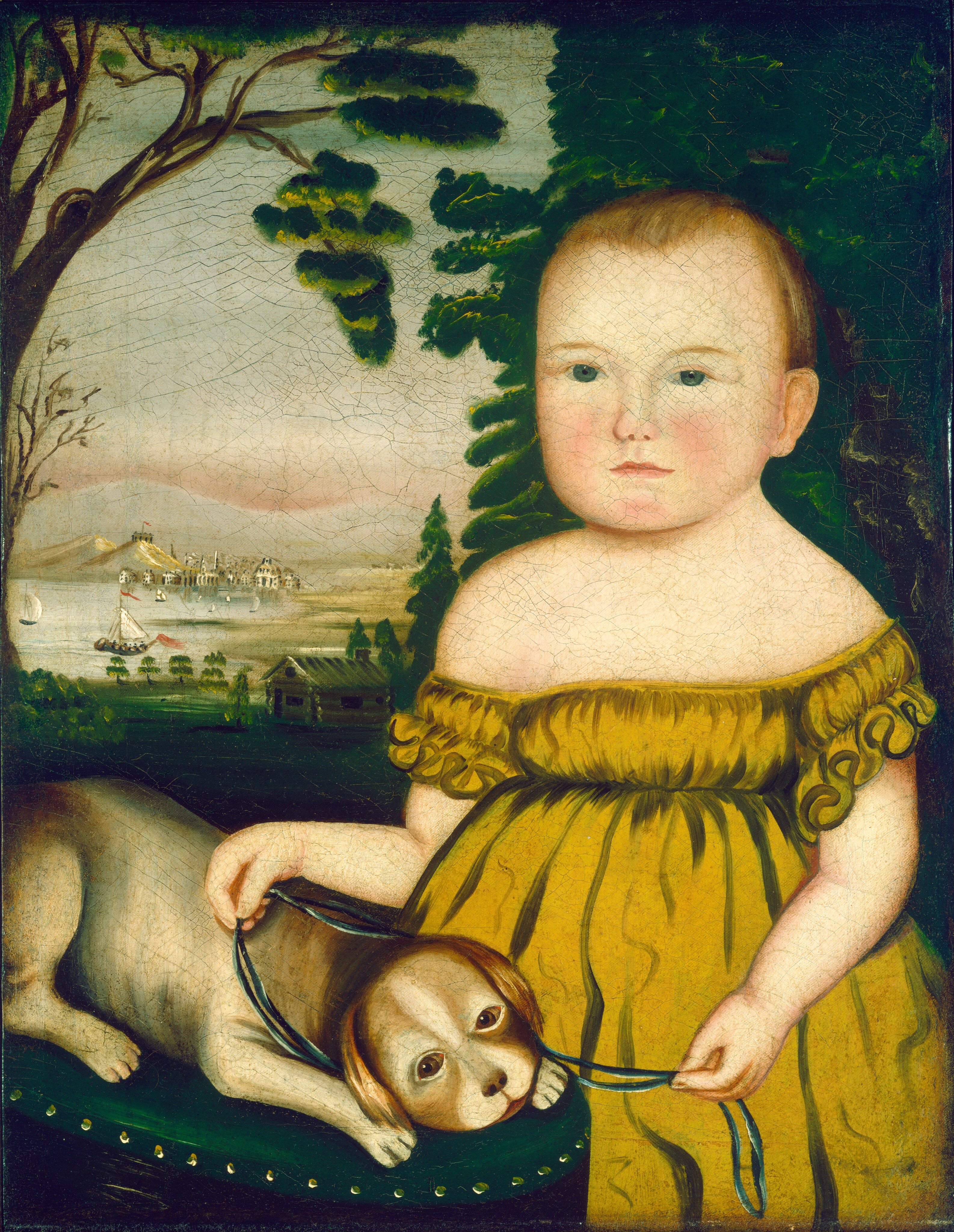 The image displays a child standing and facing forward. The child has a round face with rosy cheeks, wide blue eyes, and a small closed mouth. The child's hair is light and short. They are wearing a yellow dress with ruffled off-the-shoulder sleeves and holding a blue ribbon attached to a small dog with a beige and brown coat on a green cushion. The background shows greenery, trees, a small house, water with sailboats, and a village in the distance.