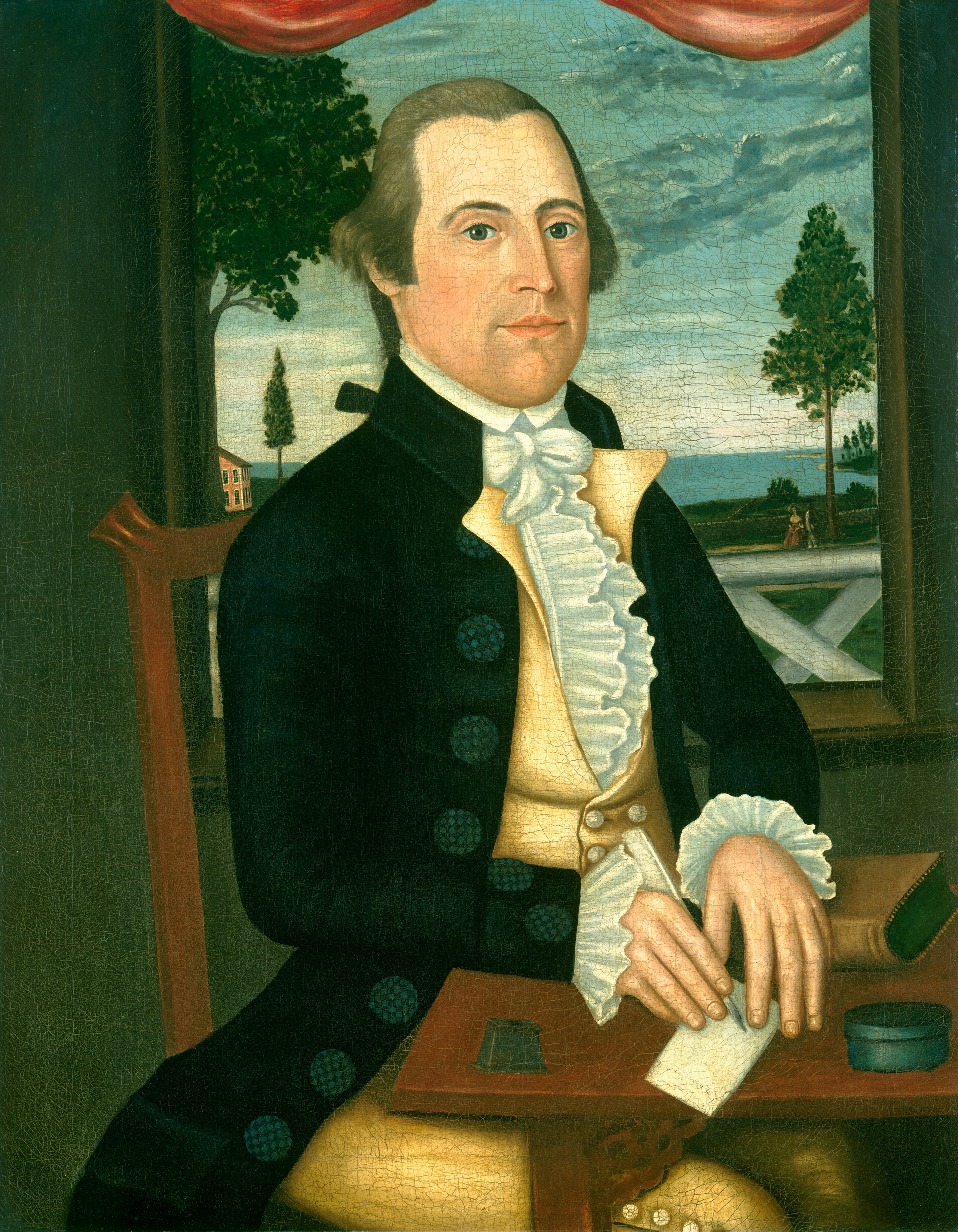 The image shows a half-length portrait of a man seated at a table. He is positioned with his body turned slightly to the right and his head facing forward towards the viewer. The man has a fair complexion, with light facial features, including light-colored eyes and a calm expression. His hair is brown and combed back, with slight waves on the side. He is wearing a formal dark jacket with large decorative buttons, a cream-colored waistcoat, and an elaborate white cravat with ruffled edges at the neck and cuffs. In his hand, he holds a quill, poised over a sheet of paper on the table. Beside the paper, there is an inkwell and another small cylindrical container. The background features a window view of a landscape, including a tree, a body of water, and a cloudy sky, with a red curtain draped across the top. A building is partially visible on the left side of the window.