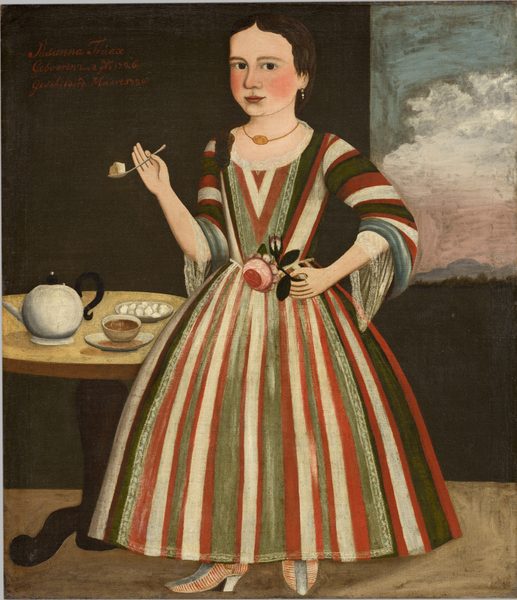 A pale-skinned girl wearing a striped dress and holding up a spoon and a rose looks out at us in this vertical portrait painting. Her body faces us, and her head turns lightly to the left. She has a wide, square face with large, dark eyes, flushed cheeks, and her dark pink lips curve in a slight smile. Her dark brown hair is parted in the middle and gathered at the nape of her neck. A thick curl drapes over one shoulder. Her dress has a rounded, lace-edged neckline, a tightly fitting bodice, long, and loose sleeves gathered at the elbows over a transparent white under-shirt. The ankle-length skirt flares from the waist, and the dress is vertically striped in apple red, forest and laurel green, and white. She wears a dangling pearl earring in the ear we can see, and her gold necklace has a horizontal, oval, gold plaque at the center. Her shoes have low heels and are striped red and white to either side of a gray band that runs back from the pointed toes along the shank of the shoe. The girl holds a spoon in her raised right hand, to our left, with what appears to be a sugar cube on it. Her other elbow is bent so she holds a pink rose at her waist with that hand. To the left, a small round wooden table holds a white teapot with a black handle and lid finial, a teacup and saucer, and a dish of what appears to be sugar cubes or sweets. The wall behind the young woman is dark pine green, and the floor is tan. A window over one shoulder, in the upper right quadrant of the painting, shows a pink, white, and blue sunset sky over a low band of dark green trees. Text painted in red at the upper left reads, “Susanna Truax, Gebooren den 8 1726, Geschilderd Maart, 173.” The final number looks like it could be a 0 or a 9.