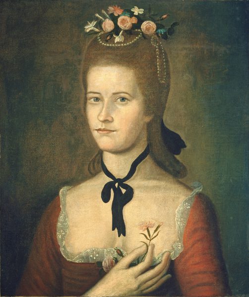The image shows a woman from the waist up, facing the viewer directly with her upper body slightly turned to the left. She has a serene expression and light-colored eyes with a soft, closed-mouth smile. Her hair is styled with flowers and pearls, and she is wearing a dark red gown with lace trim. She has a black ribbon tied around her neck in a bow and is holding a pink flower in her hands. The background is a textured, muted green.