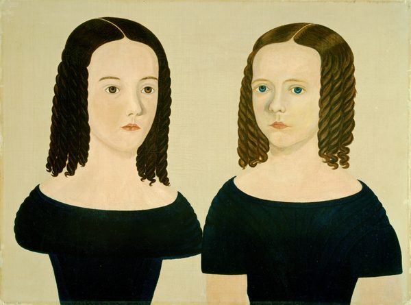 The image shows a bust-length portrait of two young girls positioned side by side, occupying the left and right halves of the canvas. Both girls are facing forward, with their bodies angled slightly inward toward each other. They have pale complexions with prominent facial features; the girl on the left has large brown eyes, while the girl on the right has striking blue eyes. Their hair is styled in long, dark brown, tightly-coiled ringlets that fall to their shoulders, with a slight part in the middle. Both are wearing dark-colored dresses with wide, off-the-shoulder necklines that reveal their collarbones and bare necks. The background is a plain, light beige color, offering no additional context or embellishments. There are no visible pieces of jewelry or objects in their hands.
