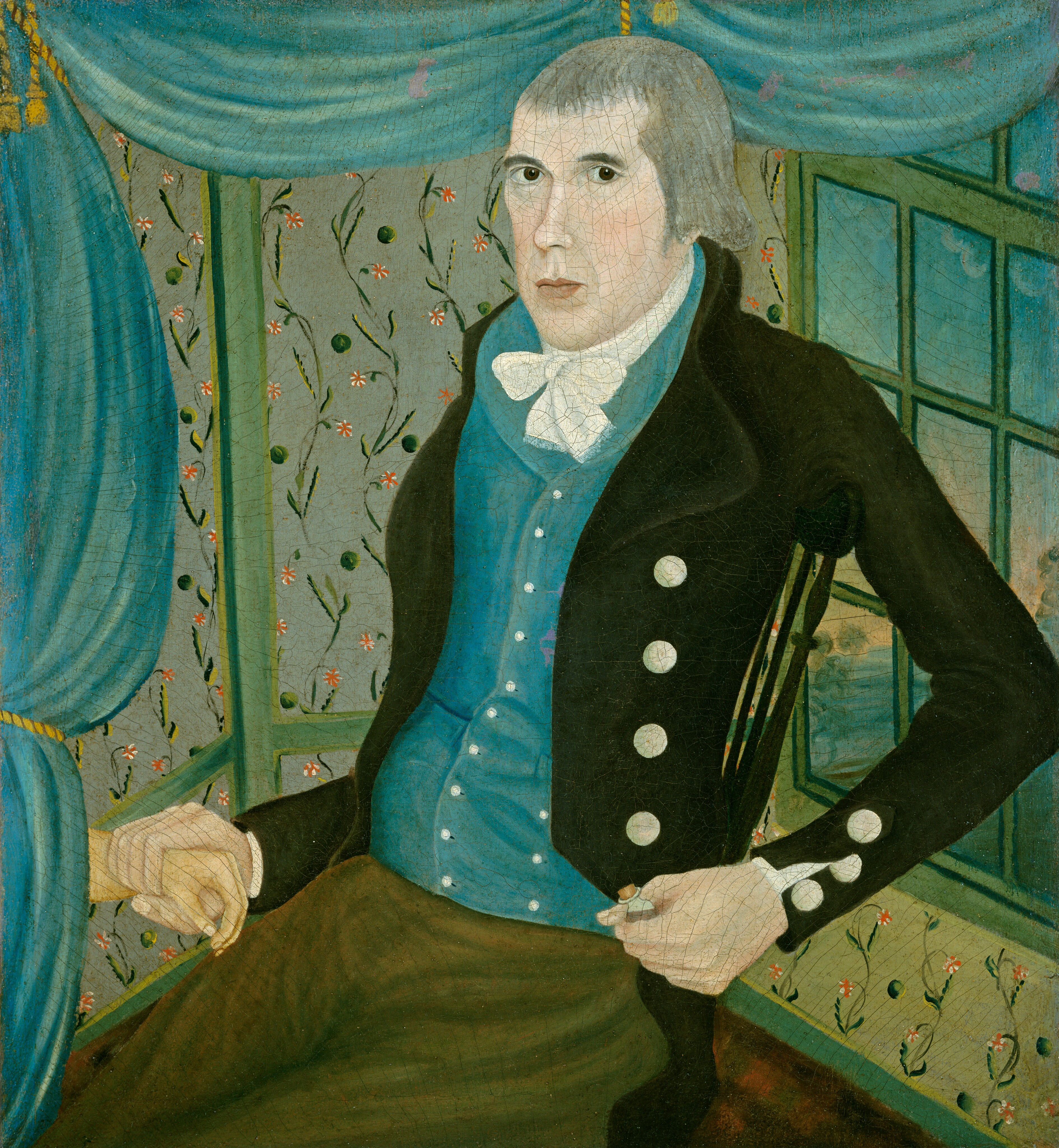 The image shows a portrait of a man depicted from the waist up. He is seated in a chair, with his body turned slightly to the right and his gaze directed forward. The man's facial features are distinct with a fair complexion, large dark eyes, and a straight nose. His hair is short and appears gray, with a slight part on one side. He is wearing a dark coat with white buttons, a blue waistcoat, a white shirt with a white cravat. He has one hand on his lap, while the other hand holds a letter or document. The background features a room with green vine and red flower wallpaper, and blue drapes. A window behind him shows a glimpse of a tree and water, suggesting an interior setting with an outside view.