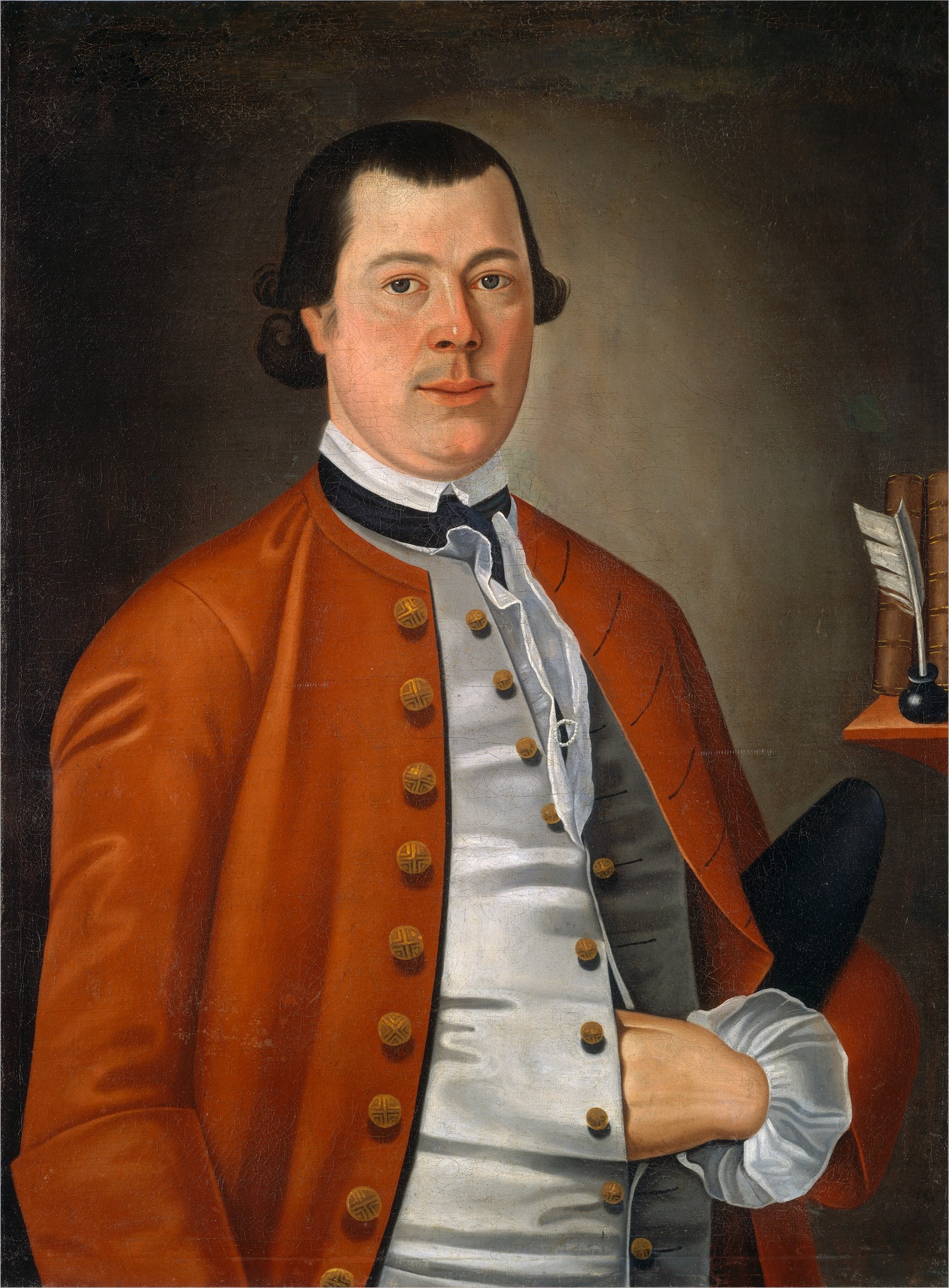 The image shows a man from the waist up, facing slightly to the right. His fair complexion contrasts with short, dark brown hair that curls a little at the ends. He maintains direct eye contact with a neutral expression, and has distinct rounded cheeks. He wears formal attire with a white shirt, buttoned waistcoat, and deep orange overcoat with gold buttons. He sports a white cravat, elaborate ruffled cuffs, and his right hand is in his waistcoat. In the background, to the right, there is a shelf holding objects like a bound book and a quill in an inkwell. The backdrop is plain and brown.