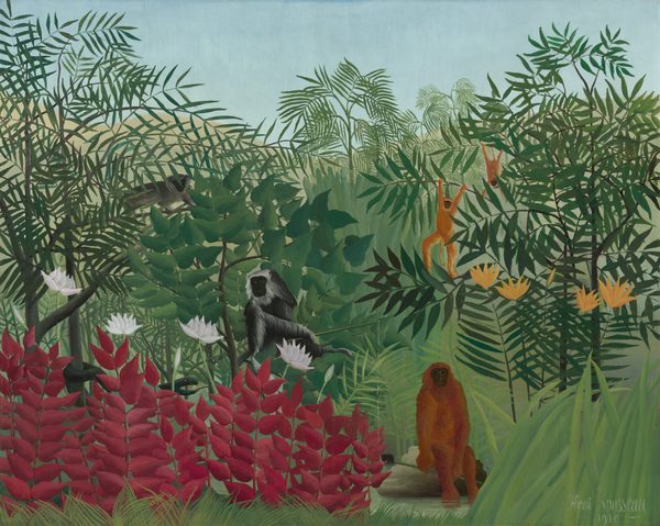 Five monkeys rest and play amid a lush jungle landscape in this horizontal landscape painting. Painted with areas of flat color, thick vegetation fills most of the scene, with giant leaves overlapping in shades of green. At the bottom center, a large brown monkey sits upright on a rock, looking directly at us. To our left, two gray and black monkeys climb in trees, and also face us. To our right, two rust-orange monkeys swing in trees. The orange of their fur is echoed in spiky, pumpkin-orange flowers to the right. Dark red leafy plants with spiky white flowers fill the lower left corner of the painting. A cloudless, pale blue sky stretches across the top of the composition. The artist signed and dated the painting with white letters in the lower right: “Henri Rousseau 1910.”