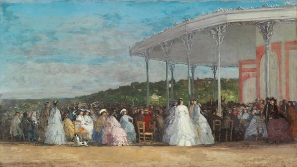 This is a painting depicting a social gathering under a large pavilion outdoors. The background shows a green, hilly landscape with hints of brown and white buildings in the distance, under a sky of soft blues with wispy gray clouds. The scene features a large crowd of elegantly dressed people, some standing and some sitting in chairs, their backs to us. To the right of center is a group of three women in large white gowns, standing in a small group with a bearded man who wears a pale-yellow scarf around his neck. On the left is a group of seated women, wearing gowns in shades of pink, white, blue, and yellow. The rest of the crowd is a blur of dark colors, with a few people wearing red or white who stick out. Beyond the crowd, under the ornate white pavilion with carved columns, we see the silhouette of a man raising a stick or baton. The brushstrokes in the painting are visible, and details are suggested with dashes of paint, giving the image a slightly hazy quality.