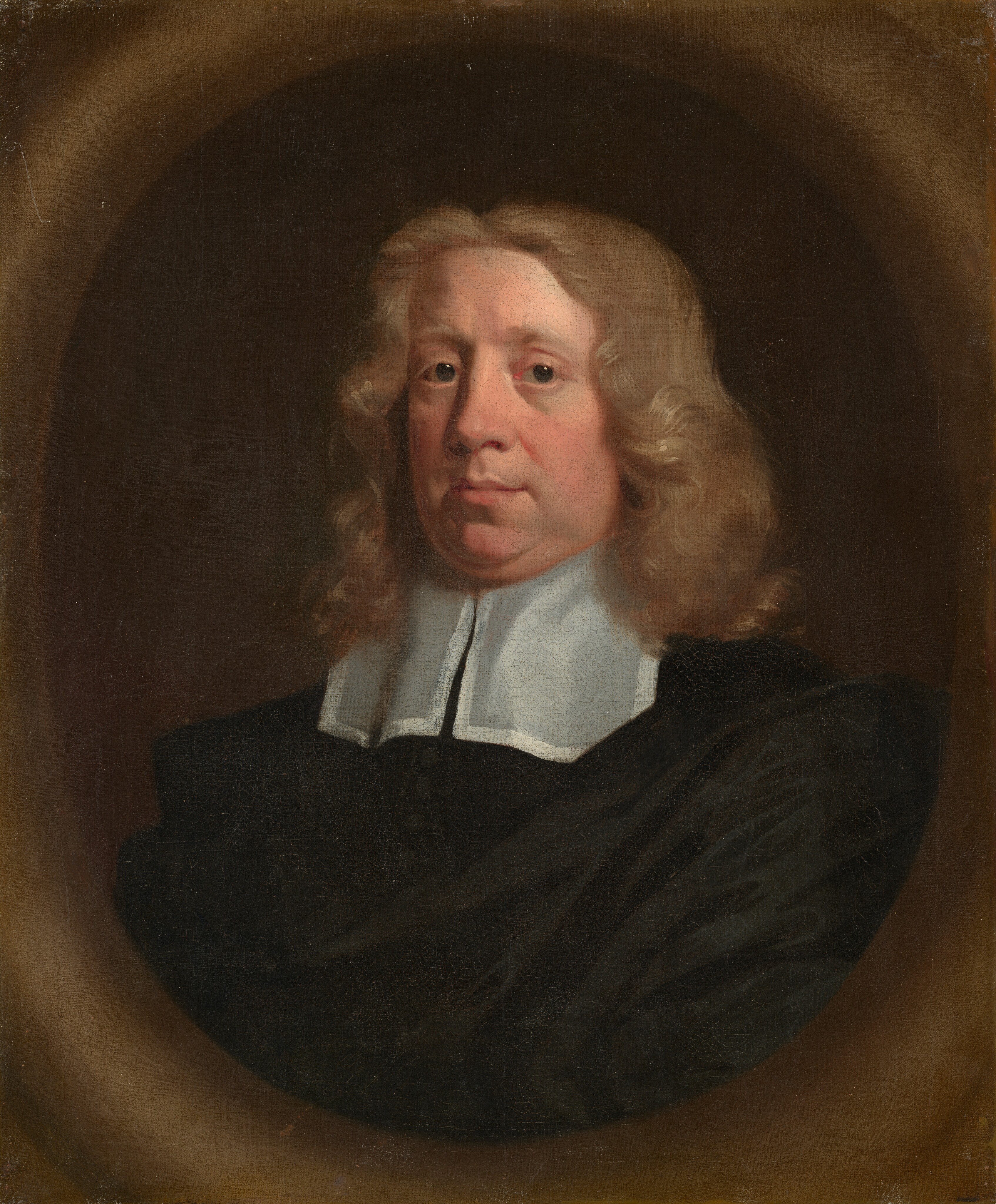 The image is a portrait of a man's upper body. He is facing slightly to the side, with his head turned towards the viewer. The man has wavy, light brown or blonde hair that falls to his shoulders. His facial features include a round face, prominent nose, and light complexion. He is wearing a dark robe with a white collar. No jewelry is visible, and his hands are not shown. The background is a muted brownish hue, creating an oval frame around the figure.