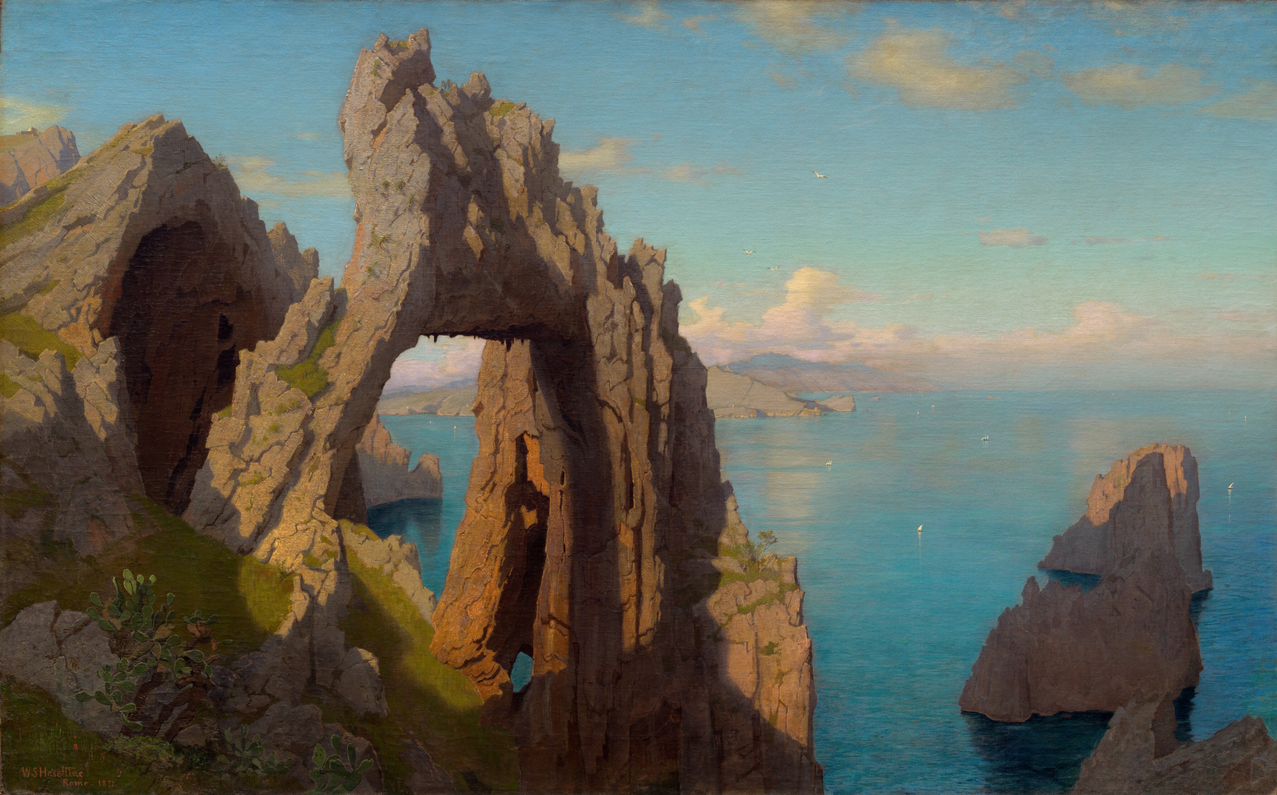 We look slightly down onto a rocky, natural stone arch next to a cave opening, both perched on a high, grassy cliff in front of a shimmering, aquamarine-blue body of water in this horizontal landscape painting. The arch is situated to our left of center, and the cave beyond the gaping opening extends off the left side of the canvas. In tones of ash and caramel brown, the jagged arch and outcroppings are lit from our left so deep shadows are cast along crevasses to our right. Shadow also sweeps across the emerald-green grass at the base of the arch and cave. A few more serrated rocks poke out of the water like teeth far below, to our right, presumably at the base of the cliff on which we are situated. To our left, the rocky shoreline juts into the water in the distance in front of mauve-purple mountains in the deep distance along the horizon, which comes about halfway up this composition. Tiny in scale, minuscule, triangular white sails dot the waterway. Similarly tiny white birds fly high above the water. Pale, petal-pink and white clouds line the horizon beneath a sky that deepens from light turquoise over the clouds to the same aquamarine blue of the water below.