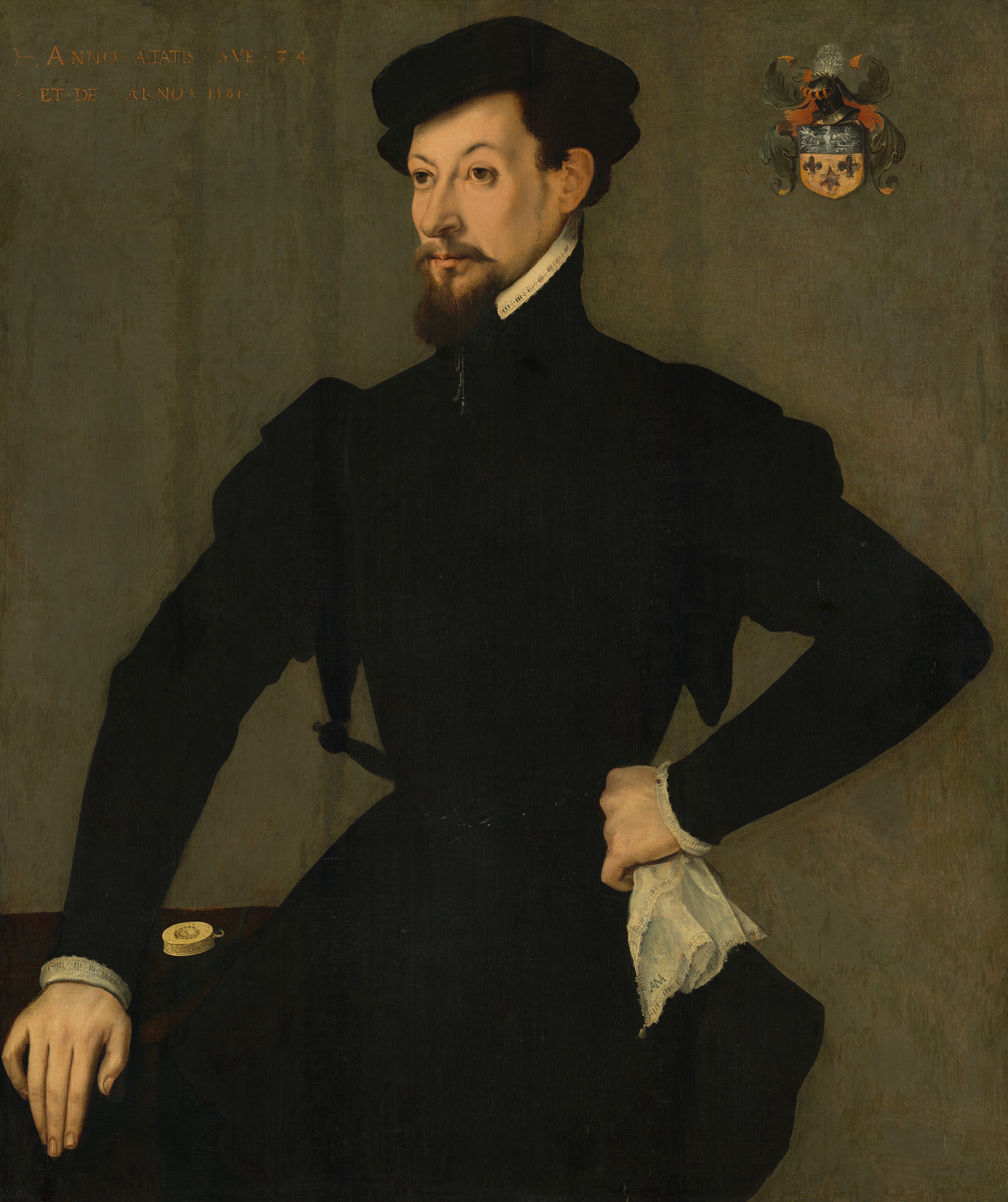 The portrait shows a man from the waist up. He is positioned at an angle with his left hand resting on a surface and his right hand on his hip, holding a white lace handkerchief. He has sharp facial features with a short dark beard and mustache, and his hair is styled neatly beneath a black cap. He is dressed in a black outfit with a high collar, and a small area of white shirt is visible at the wrist and collar. On the surface beside him rests a pocket watch. The background is plain and features a coat of arms in the upper right corner.