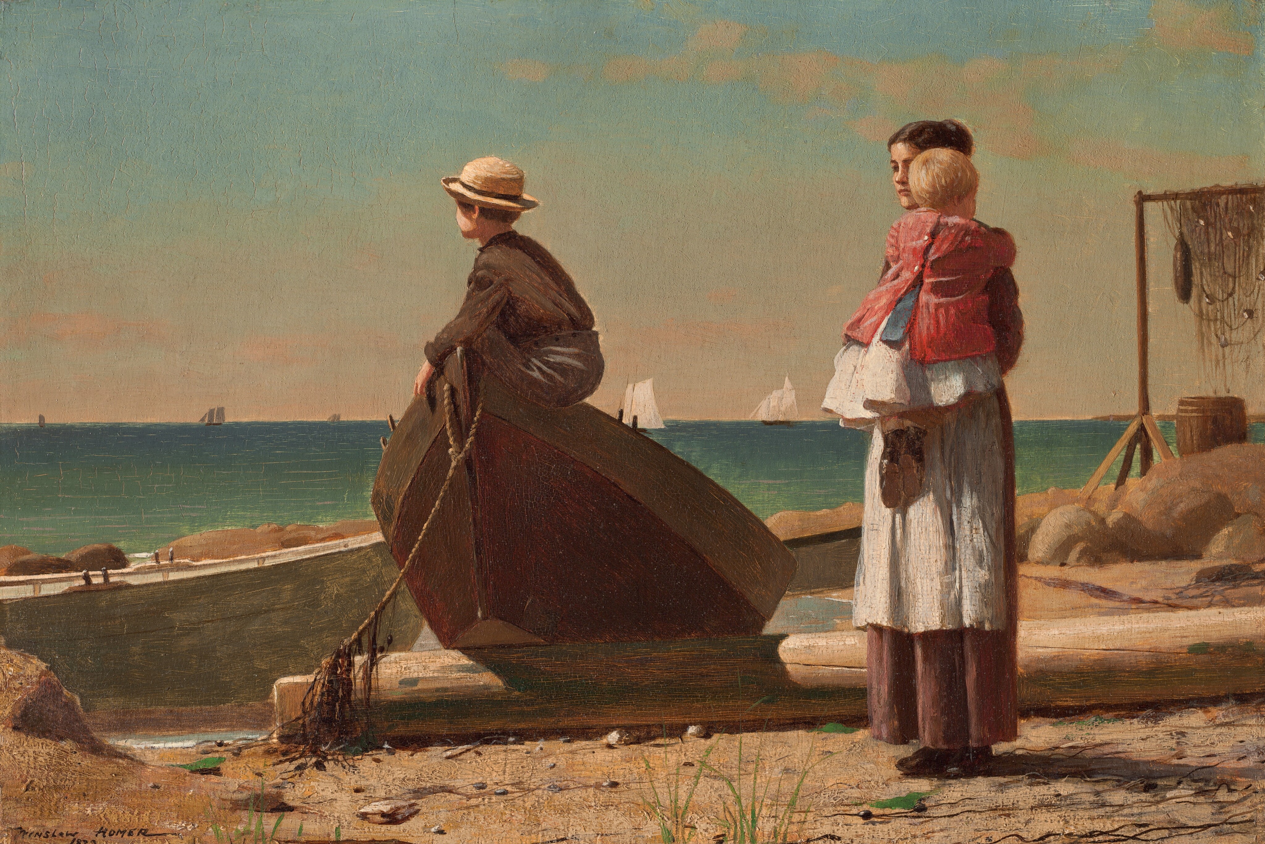 A woman holding a baby stands near a young boy who perches in the tipped-up end of a rowboat that has been pulled onto a sandy beach in this horizontal painting. All the people have light skin. The turquoise and aquamarine-blue ocean beyond meets the pale blue sky at the horizon line, about halfway up the composition. To our left of center, one end of the wooden rowboat has been propped on what might be a fallen piling on the sandy, rocky beach. The boy sitting in the bow faces our left almost in profile, and wears a round, brimmed straw hat over brown hair, a brown, long-sleeved shirt, and charcoal-gray pants. His face turns away from us so we only see his cheek and the curve of his ear. To our right, the woman’s dark hair is pulled up and she wears a white apron over a long brown skirt. She stands angled to our right and looks over the shoulder of the blond baby she holds up against her chest. The child is dressed in a white skirt, blue sash, a red jacket, and black shoes. The beach around the people is strewn with another rowboat, large boulders, a wooden barrel, and fishing nets hung over a tall frame to dry. A few tufts of scrubby grass grow in the sand around the woman’s feet. The white sails of several ships line the horizon in the deep distance. Thin, pale peach clouds float across an ice-blue sky. The artist signed and dated the work in dark paint in the lower left corner: “WINSLOW HOMER 1873.”