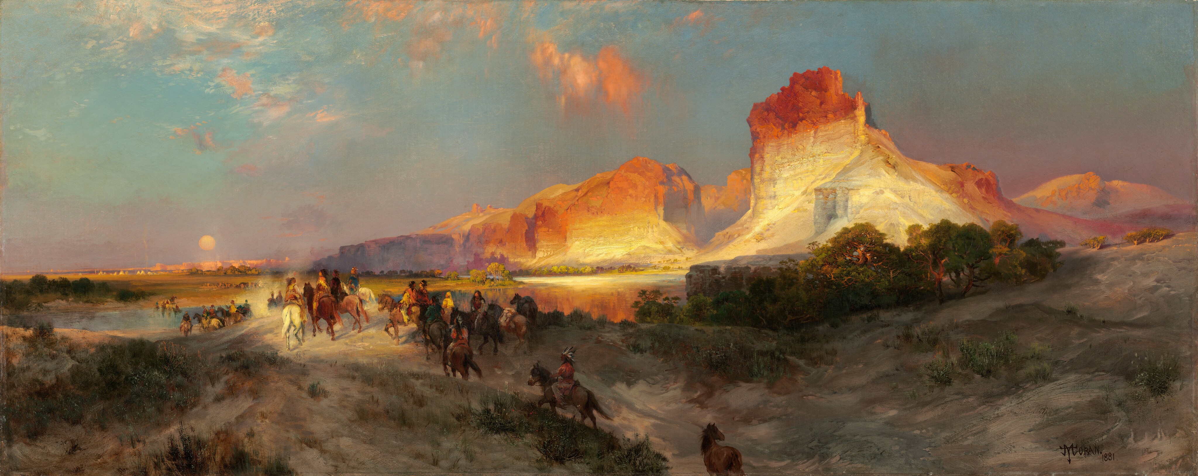 Sheer, vertical, cliffs, brightly lit in cream white and rust orange by the low sun, tower over a band of people riding horses into the distance in this long, horizontal landscape painting. The glowing cliffs dominate the upper right quadrant of the painting. They lighten from burnt orange along the jagged tops to flame orange down the steep sides, and are and warm, parchment white near the earth. One tall, narrow promontory to our right looms over a range of lower, rounded cliffs. As the cliffs move into the distance, they are shrouded with a lavender-purple haze. The land closest to us dips into a shallow valley at the bottom center of the composition, leading away from us. The dirt-packed earth is dotted with pine-green, scrubby bushes and vegetation and a grove of low, gnarled trees a short distance to our right. One chestnut-brown horse walks along the path at the bottom center of the composition, lagging behind a cluster of at least two dozen horses and riders winding into the distance. The horses range from ivory white to tawny brown and charcoal gray. The riders are loosely painted so some details are indistinct, but they all seem to have brown skin and dark hair. They wear feathered headdresses and garments in teal blue, fawn brown, or golden yellow. They ride over a low hill toward a crystal-blue river, and then back along a flat expanse toward a row of minuscule, triangular tepees lining the horizon in the deep distance. The horizon comes halfway up the composition, and the tepees are backed by a row of rose-pink, flat-topped cliffs. A pale yellow disk hangs low in the sky, over the distant cliffs. The sky above deepens from soft, lilac purple along the horizon to ice and sapphire blue along the top. A few wispy clouds are burnished orange in the sunlight. The artist signed and dated the painting in the lower right corner, “TYMoran 1881,” with the T, Y, and M overlapping to make a monogram.
