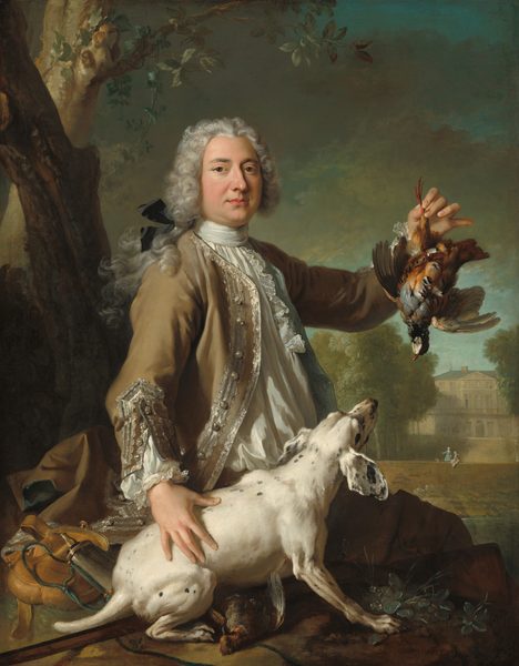 Sitting on a rock and shown from the lap up, an elegantly dressed, light-skinned man holds up a partridge by one leg and sits next to a dog, all against a landscape with trees and a stone manor house in this vertical portrait painting. On the far side of the rock, the man’s legs angle away from us to our right, but he turns his torso to look at us with brown eyes under dark brows. His nose has a bump near the bridge, and his full, pink lips are closed. His rounded cheeks are slightly flushed, and he has a bit of a double chin. His hair curls around his face from a widow’s peak on his forehead, and locks are tied back with a black silk bow. His white shirt is pleated vertically across the front below a high collar, which wraps around his neck. Lace lines the front of the shirt down the chest and the cuffs at the end of puffy sleeves. His camel-brown jacket is lined with topaz blue and edged with silvery lace down the front and at the unbuttoned cuffs. His brown pants are lost in shadow beyond the rock on which he sits. In his raised left hand, on our right, the partridge dangles from one red leg, its brown wings spread and its head hanging back. By the man’s right side and closer to us, the dog is white with a few black spots. It has large floppy ears and a short tail. It crouches on its hind legs, angled to our left, and braces itself on its front paws, looking up at the bird. A second dead bird lies on the rock under the dog’s poised body. A few tufts of plants and grasses grow out of the rock next to the dog’s front feet, and behind the dog and man is a fawn-brown sack and a cylindrical vessel with a spout, a powder horn. Two trees grow beyond the rock, up the left edge of the canvas. To our right, in the distance, two women talk near a low wall. One wears an aquamarine-blue dress and gestures with arm outstretched to our left, and the other, in pale pink, sits looking up at her companion. Beyond, trees line the drive up to the three-story manor house. The middle story is lined with notably tall windows, like a series of French doors. Steel-gray clouds against a few glimpses of turquoise-blue sky fill the top half of the painting above the house. The painting is signed and dated in the lower right corner: “peint par JB. Oudry 1722.”